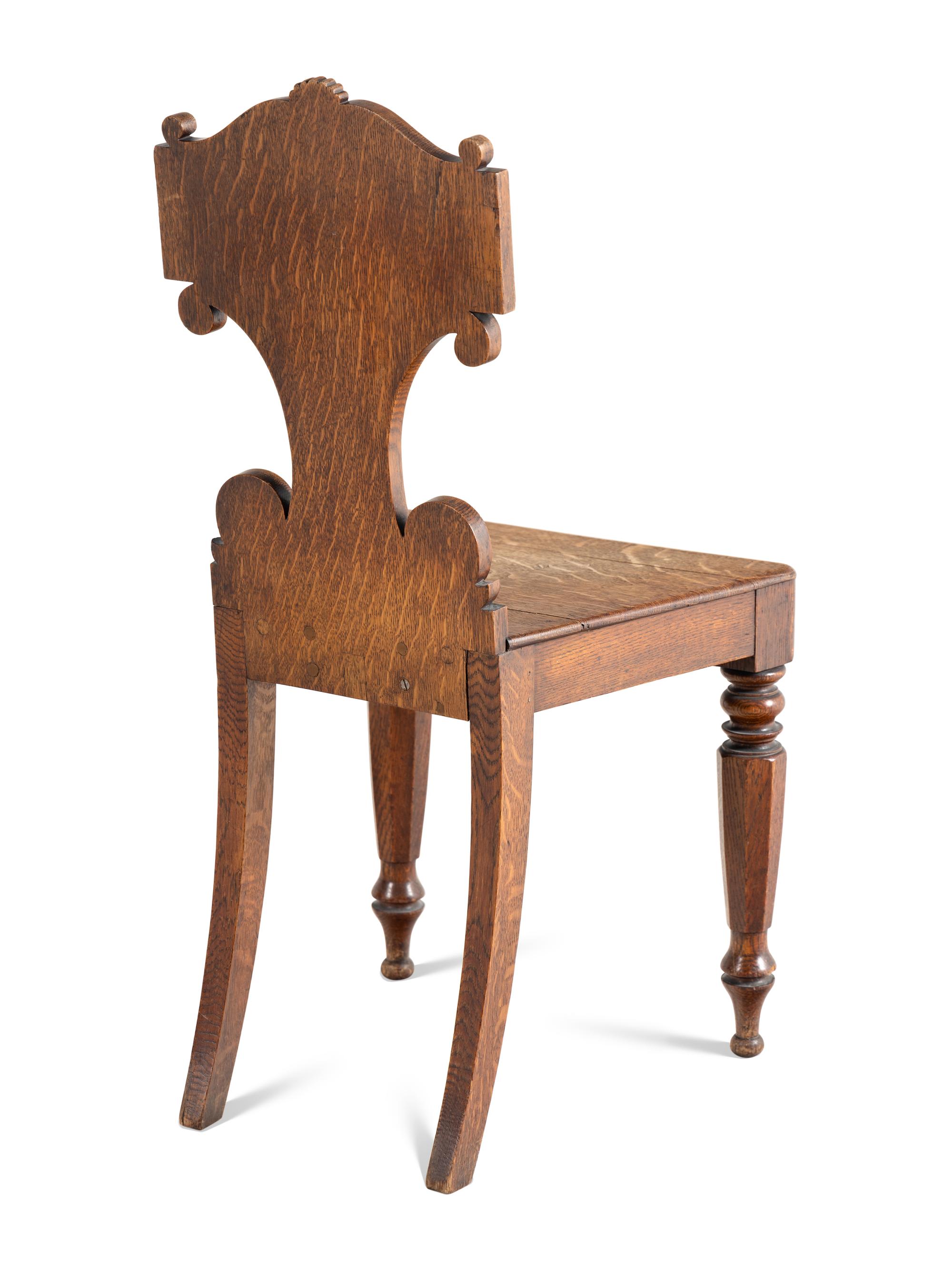 A Pair of William IV Carved Oak Hall Chairs