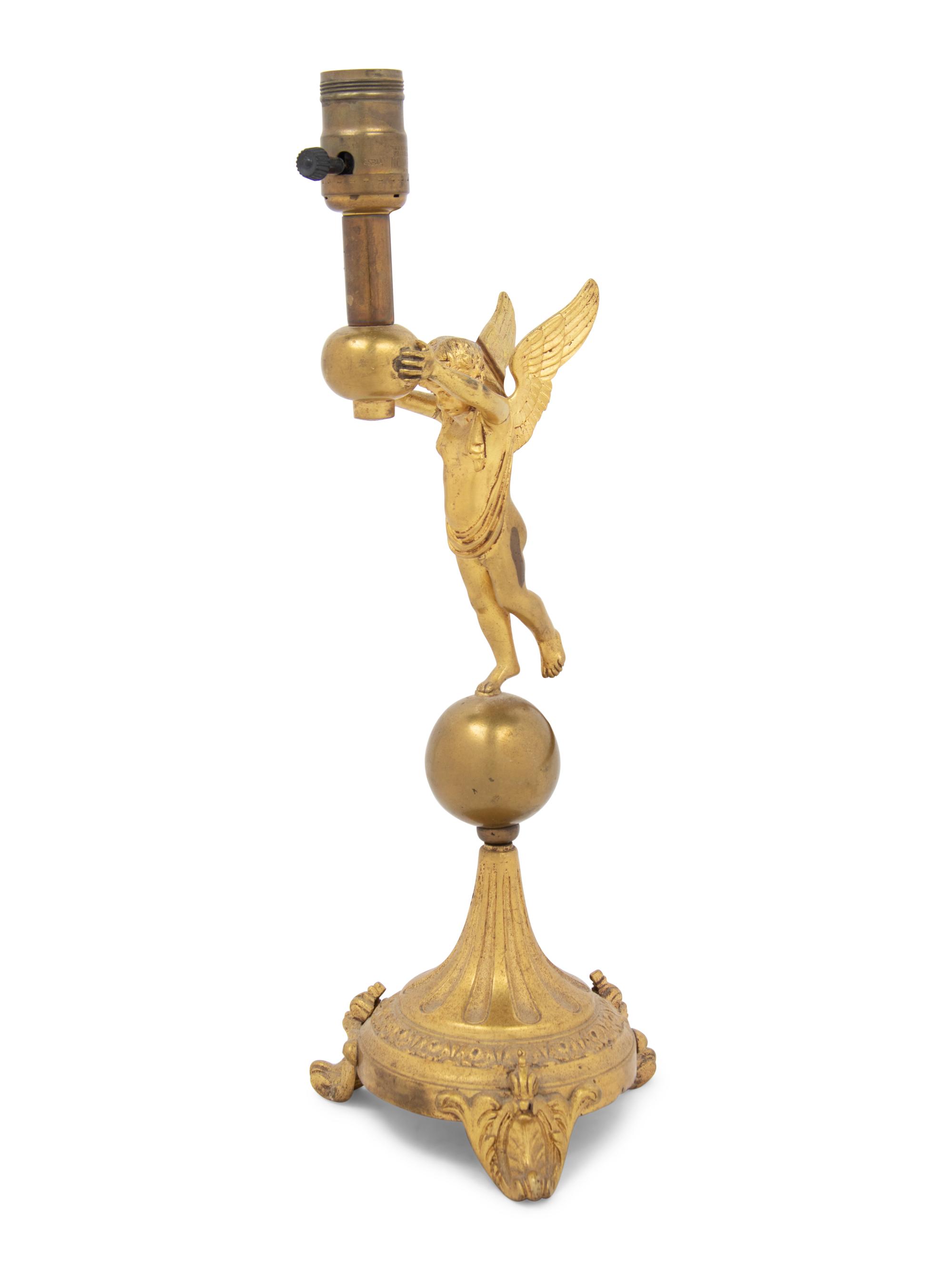 A Continental Gilt Metal Figural Lamp