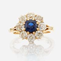 A sapphire, diamond, and gold ring
