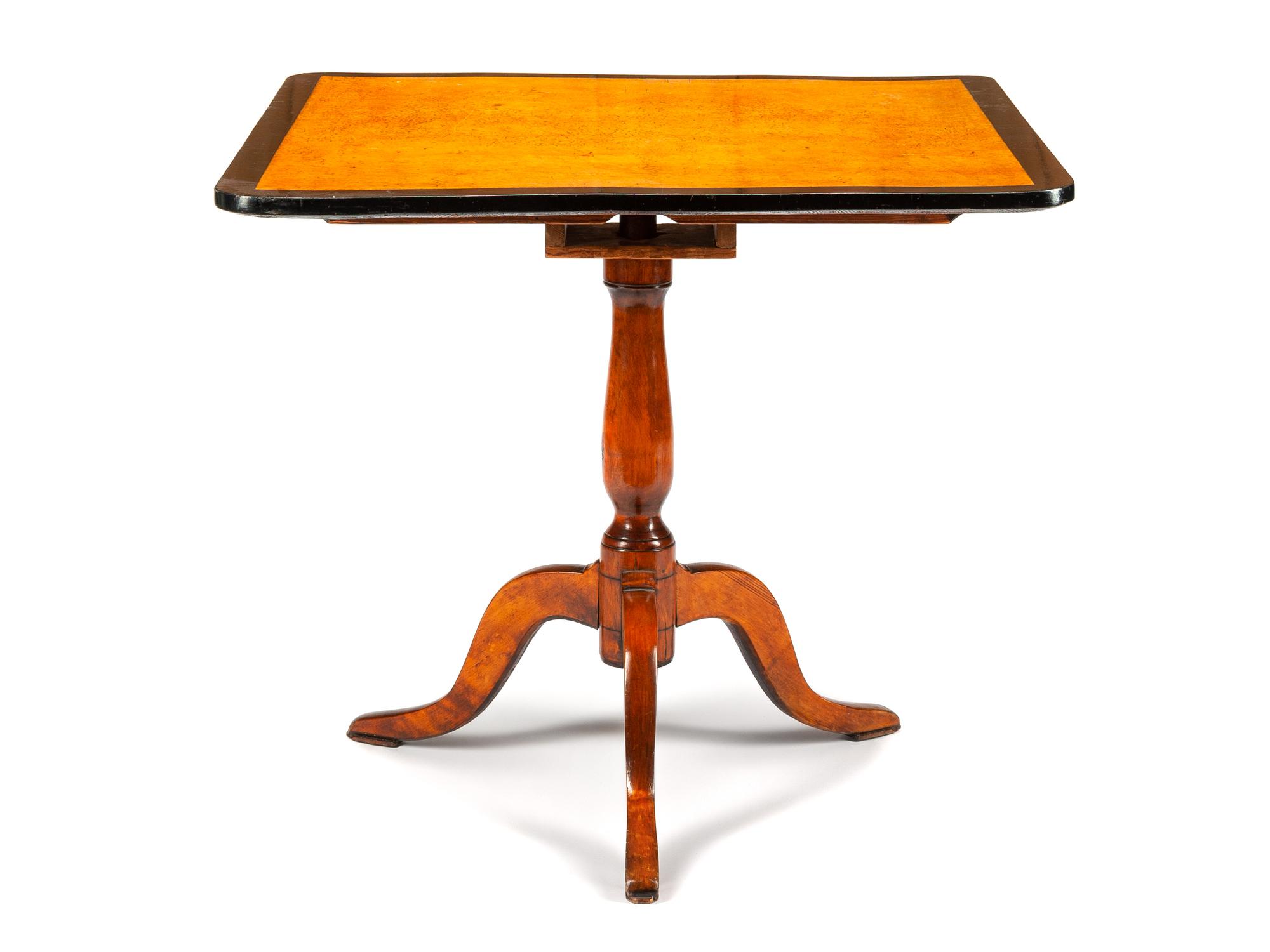 A Biedermeier Style Parcel Ebonized Table