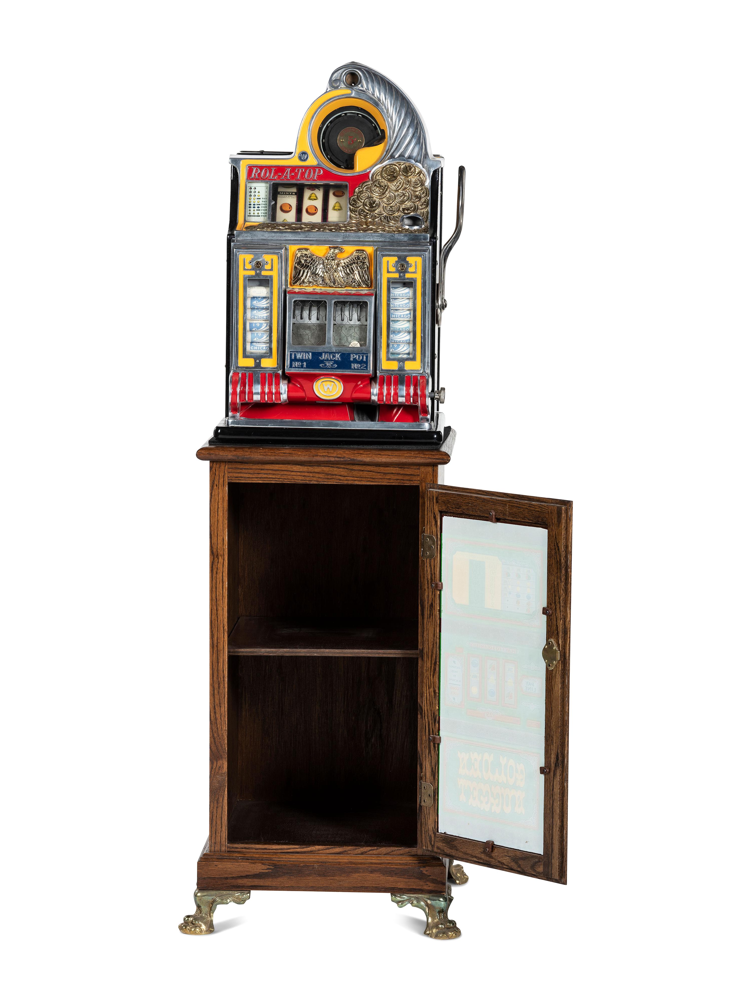 A 5 Cent Rol-A-Top Twin Jackpot Slot Machine on Reverse Printed Glass Inset Golden Nugget Stand