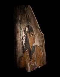 An Egyptian Polychrome Wood Fragment of a Sarcophagus with Isis