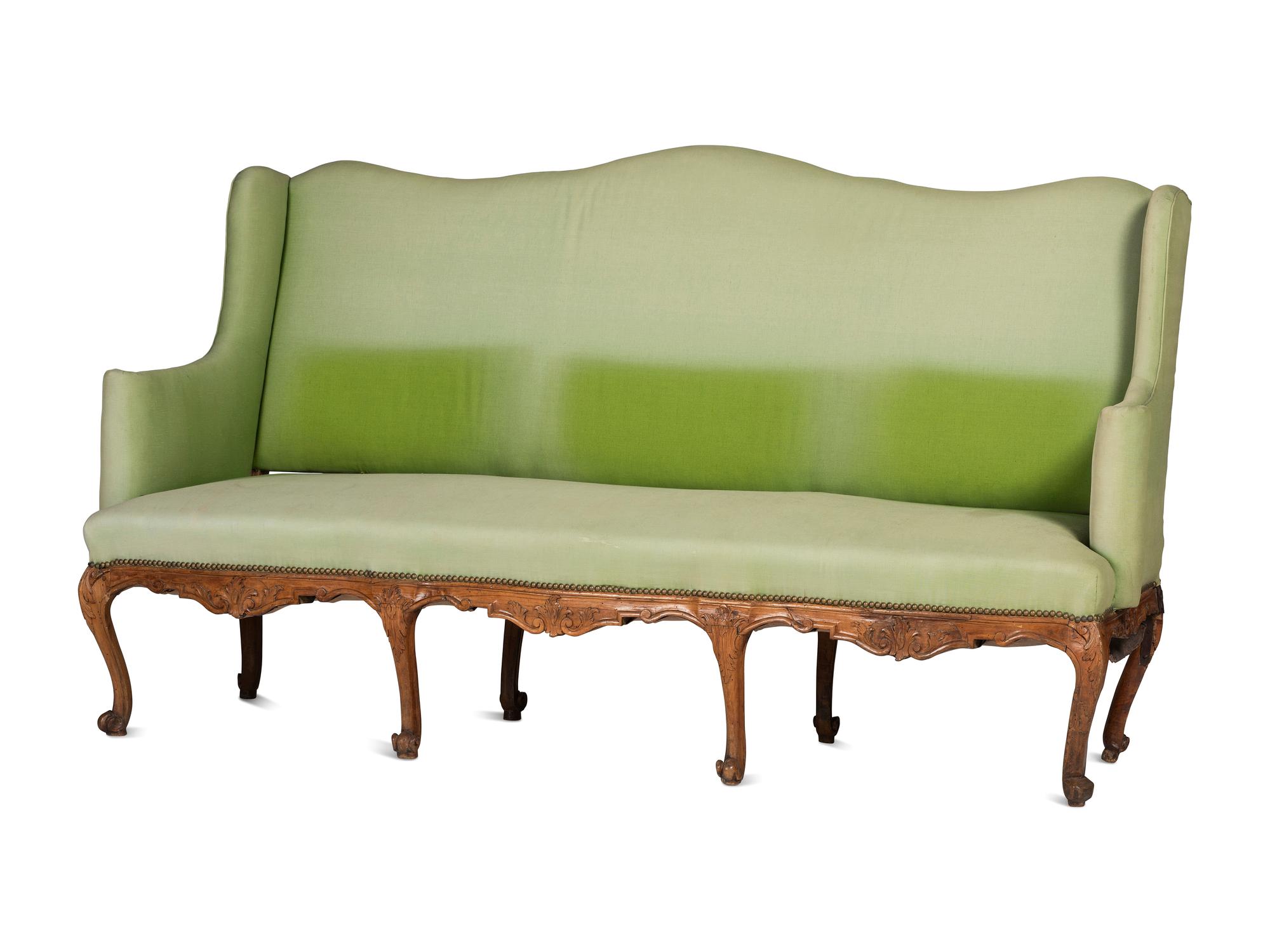 A French Provincial Carved Fruitwood Upholstered High-Back Sofa