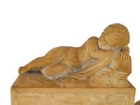 A Pair of Marble Models of Sleeping Cherubs on Plinths