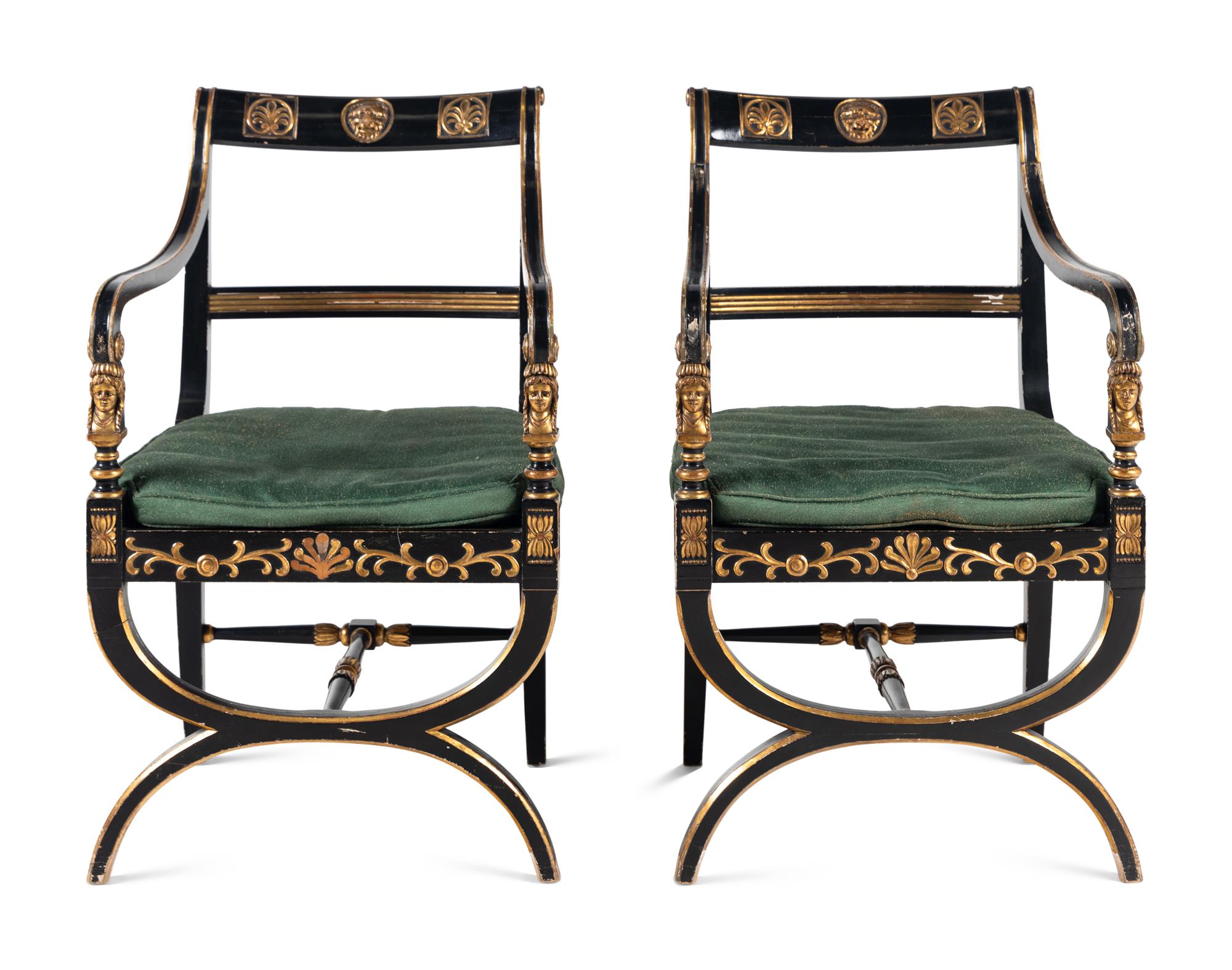 A Pair of Empire Style Ebonized and Parcel Gilt Curule Form Armchairs