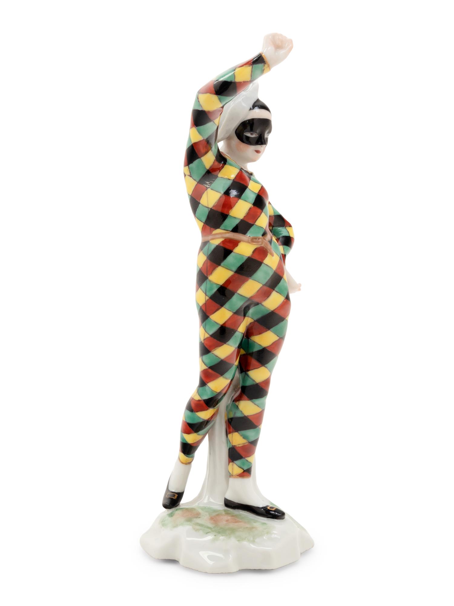 A German Porcelain Harlequin Figure