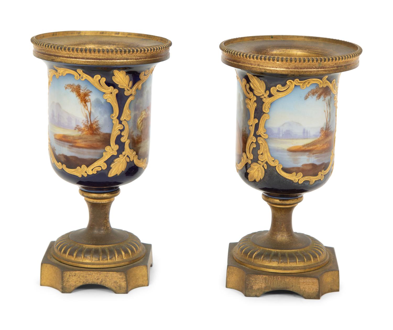 A Pair of Small Sevrés Style Porcelain and Gilt Bronze Urns