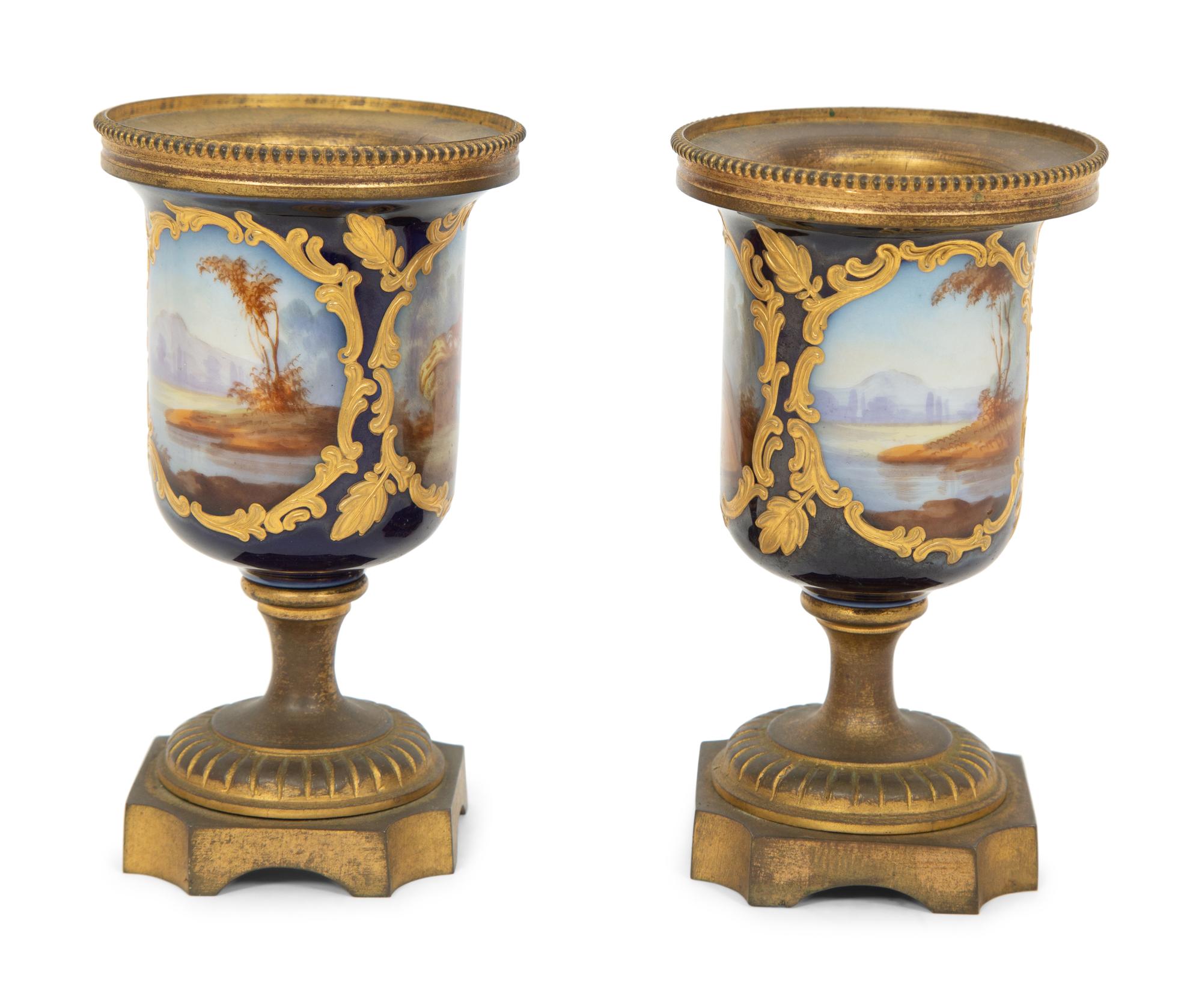 A Pair of Small Sevrés Style Porcelain and Gilt Bronze Urns