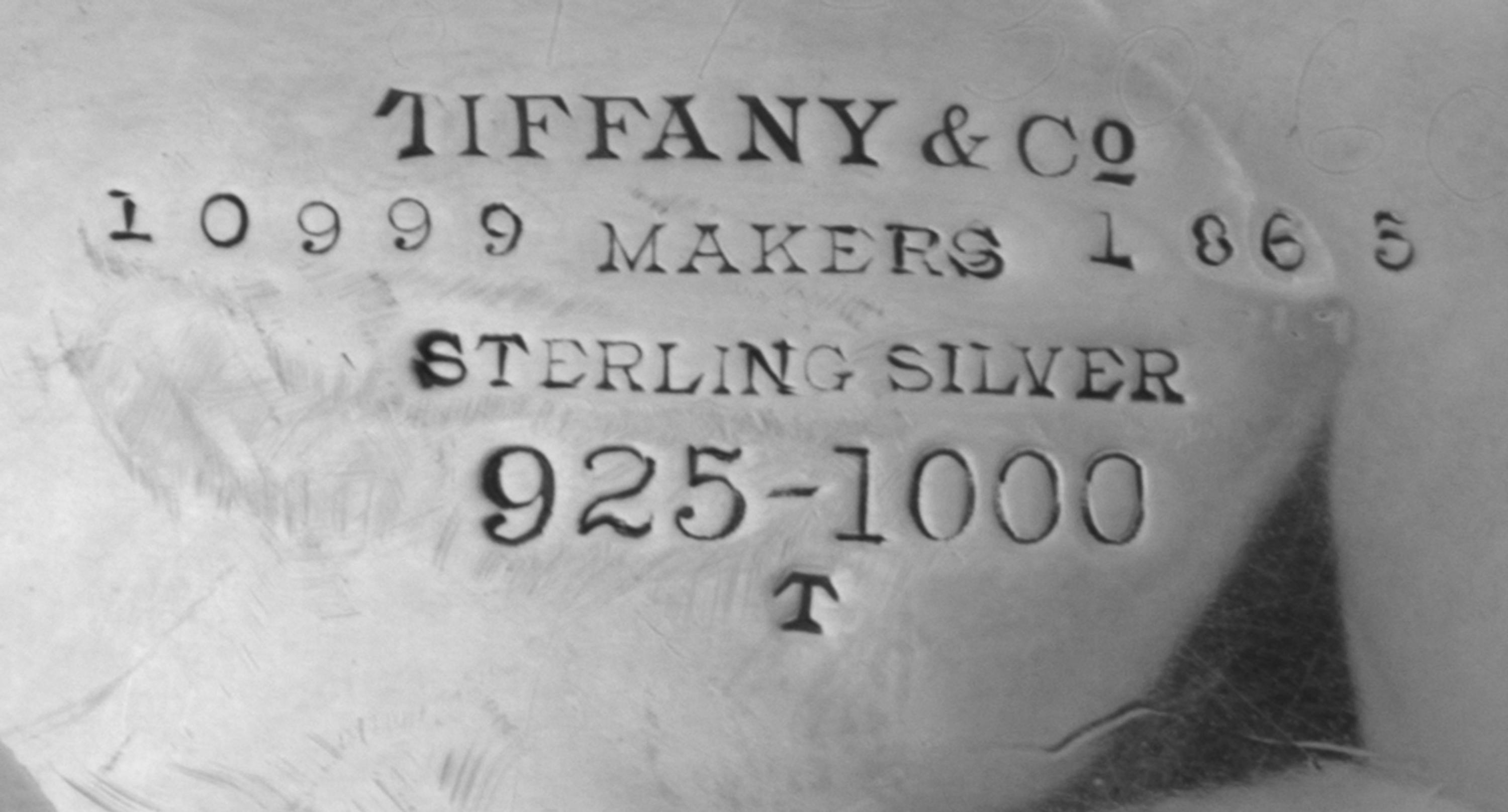 A Pair of American Silver Serving Bowls, Tiffany & Co., New York, NY, of oval form, having pierced sides with applied foliate scroll an