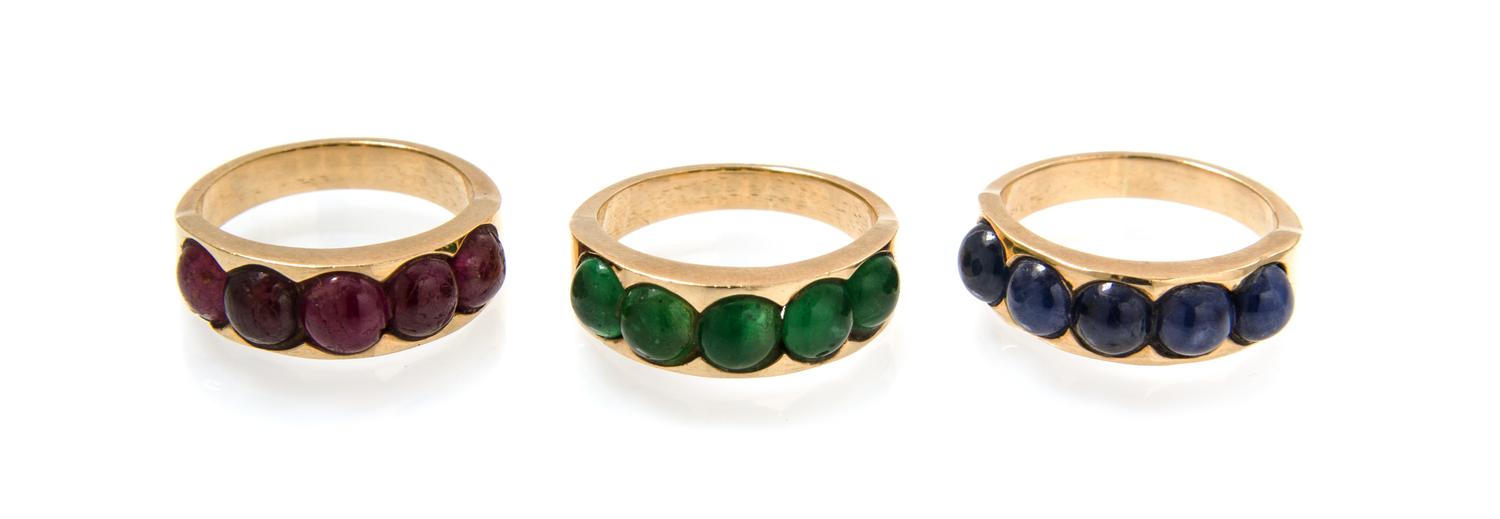 A Collection of Yellow Gold, Ruby, Emerald and Sapphire Stacking Rings, 9.50 dwts.