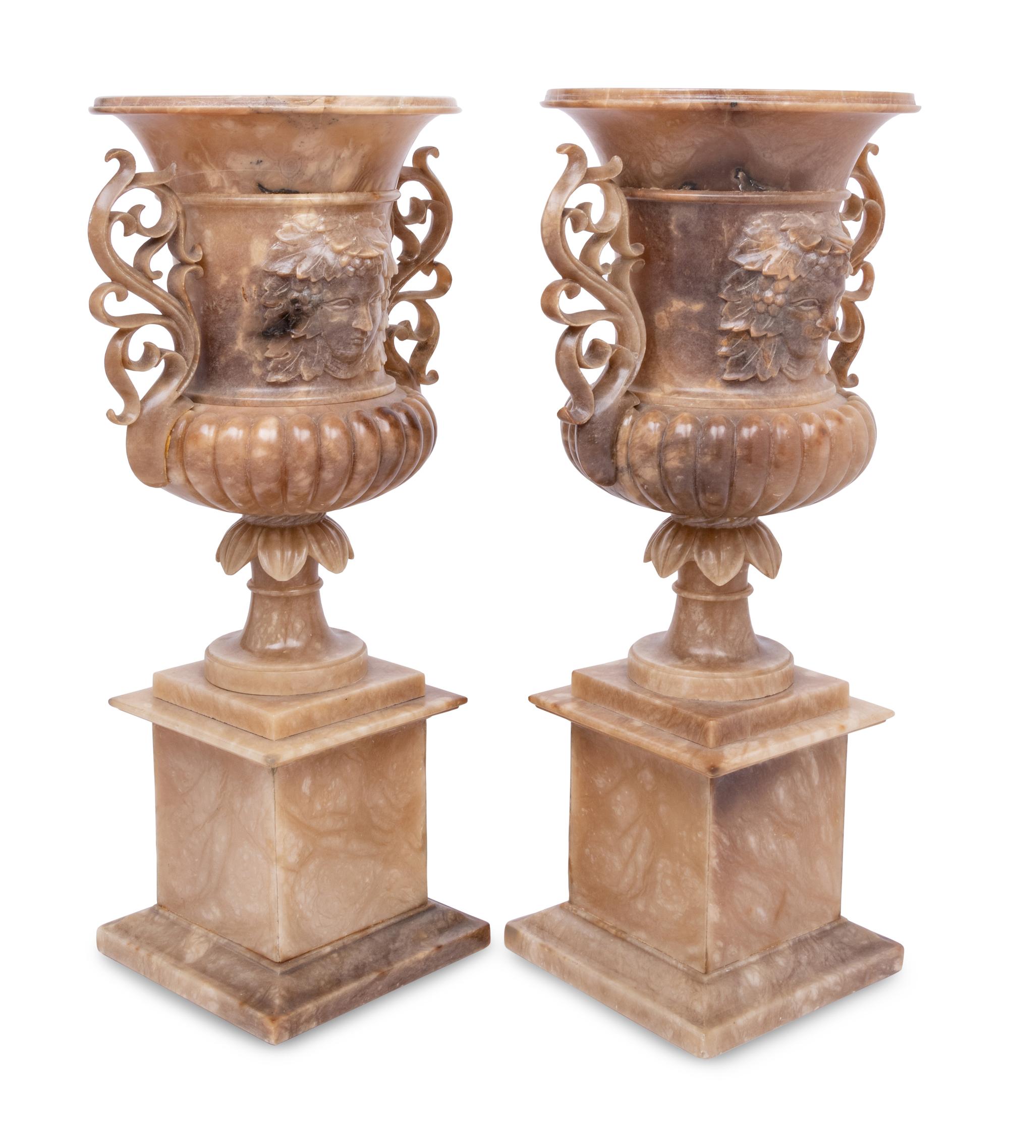 A Pair of Carved Alabaster Urns