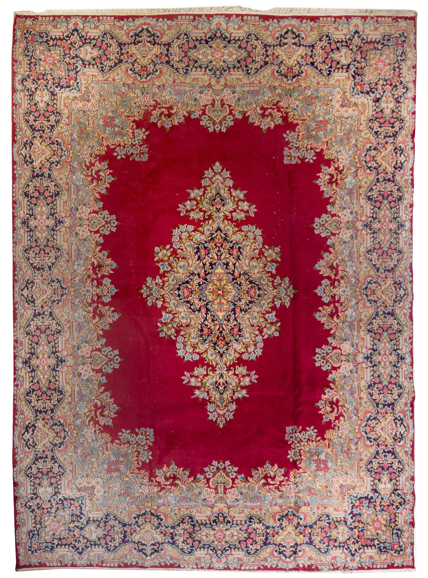 A Kirman Wool Rug 13 feet 4 inches x 9 feet 8 inches. — MID-20TH CENTURY