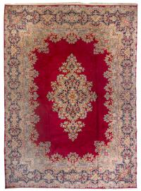 A Kirman Wool Rug 13 feet 4 inches x 9 feet 8 inches. — MID-20TH CENTURY