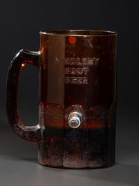A 'Middleby Root Beer' Glass Countertop Syrup Dispenser