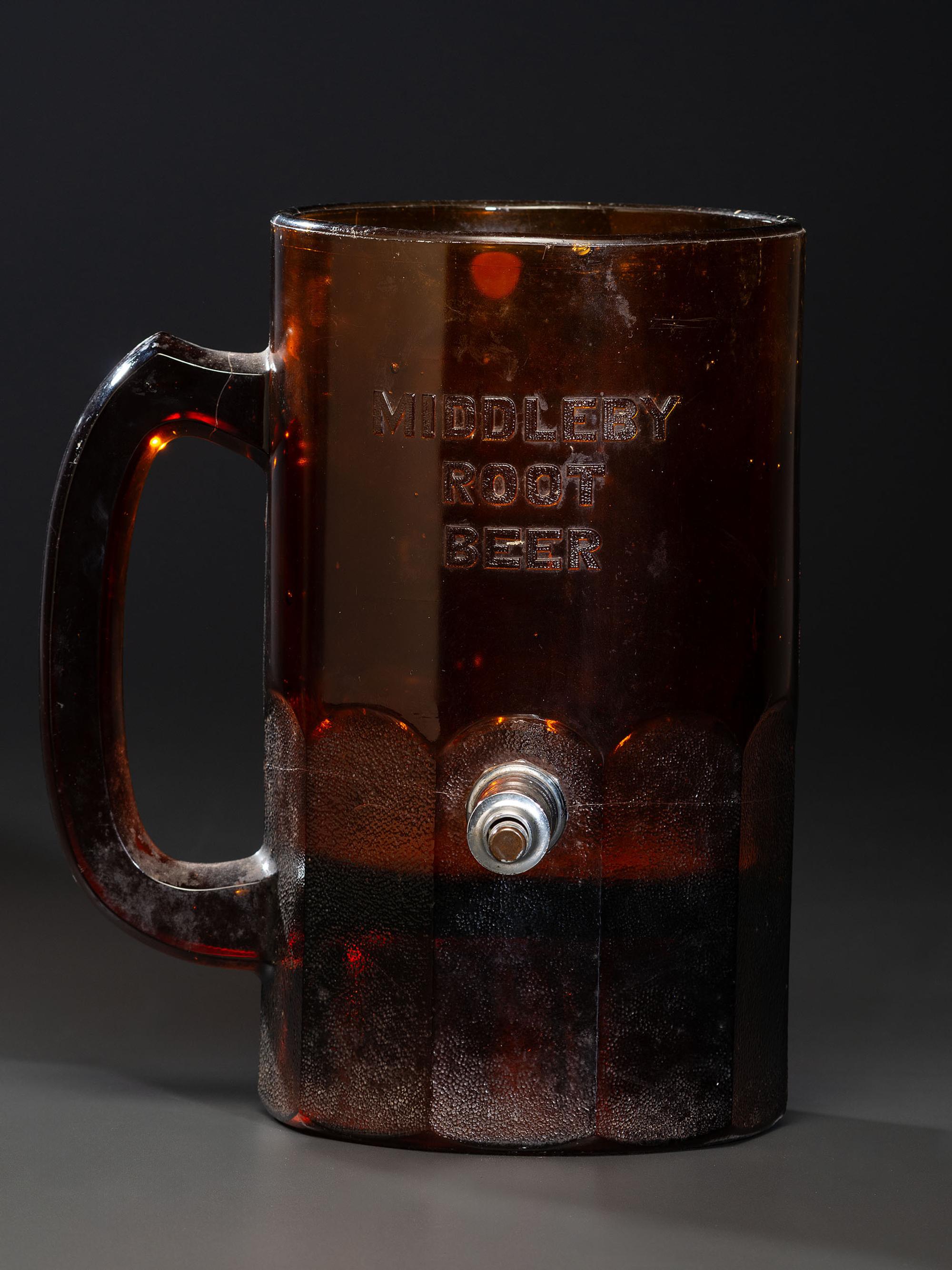 A 'Middleby Root Beer' Glass Countertop Syrup Dispenser