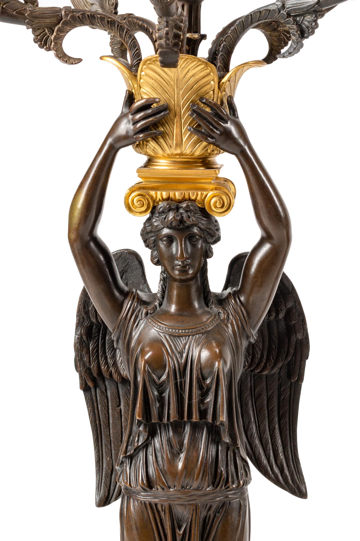 A Large Empire Style Gilt and Patinated Bronze Clock Garniture
