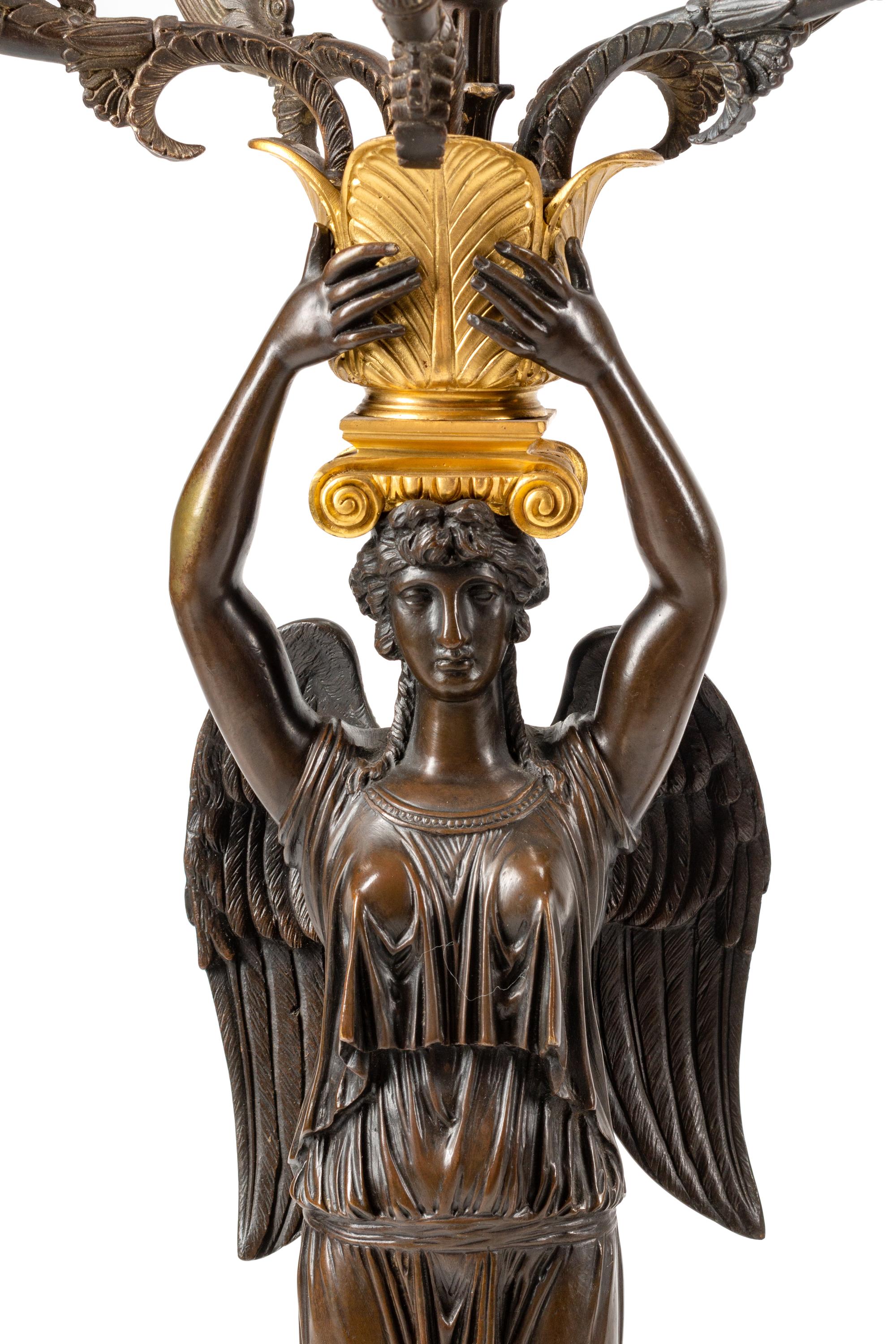 A Large Empire Style Gilt and Patinated Bronze Clock Garniture