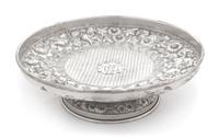 An American Silver Cake Stand, F. Bucher & Sons, Baltimore, MD, having allover floral and foliate repousse decoration and centered by a