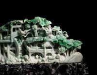 A Large Carved Apple Green and Celadon Jadeite Mountain