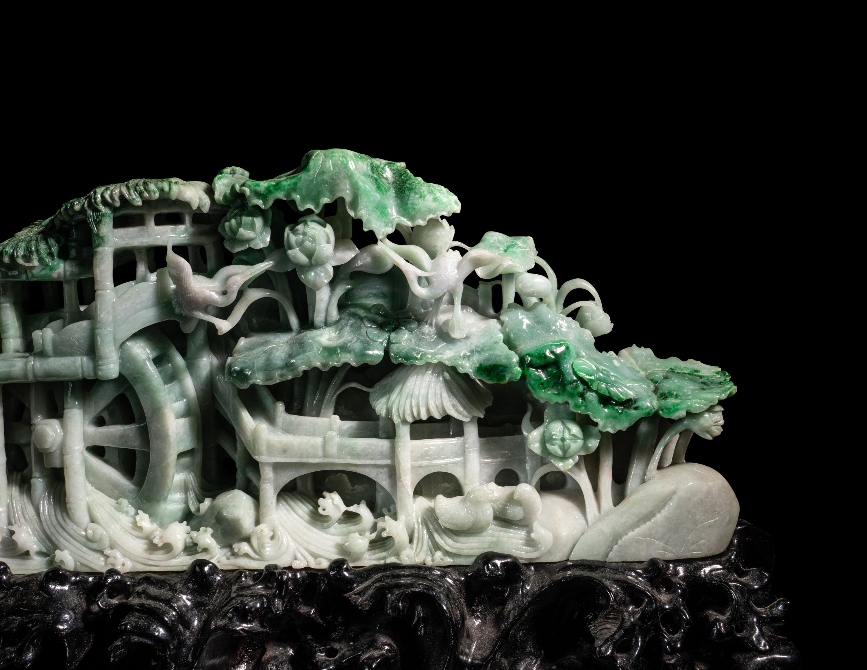A Large Carved Apple Green and Celadon Jadeite Mountain