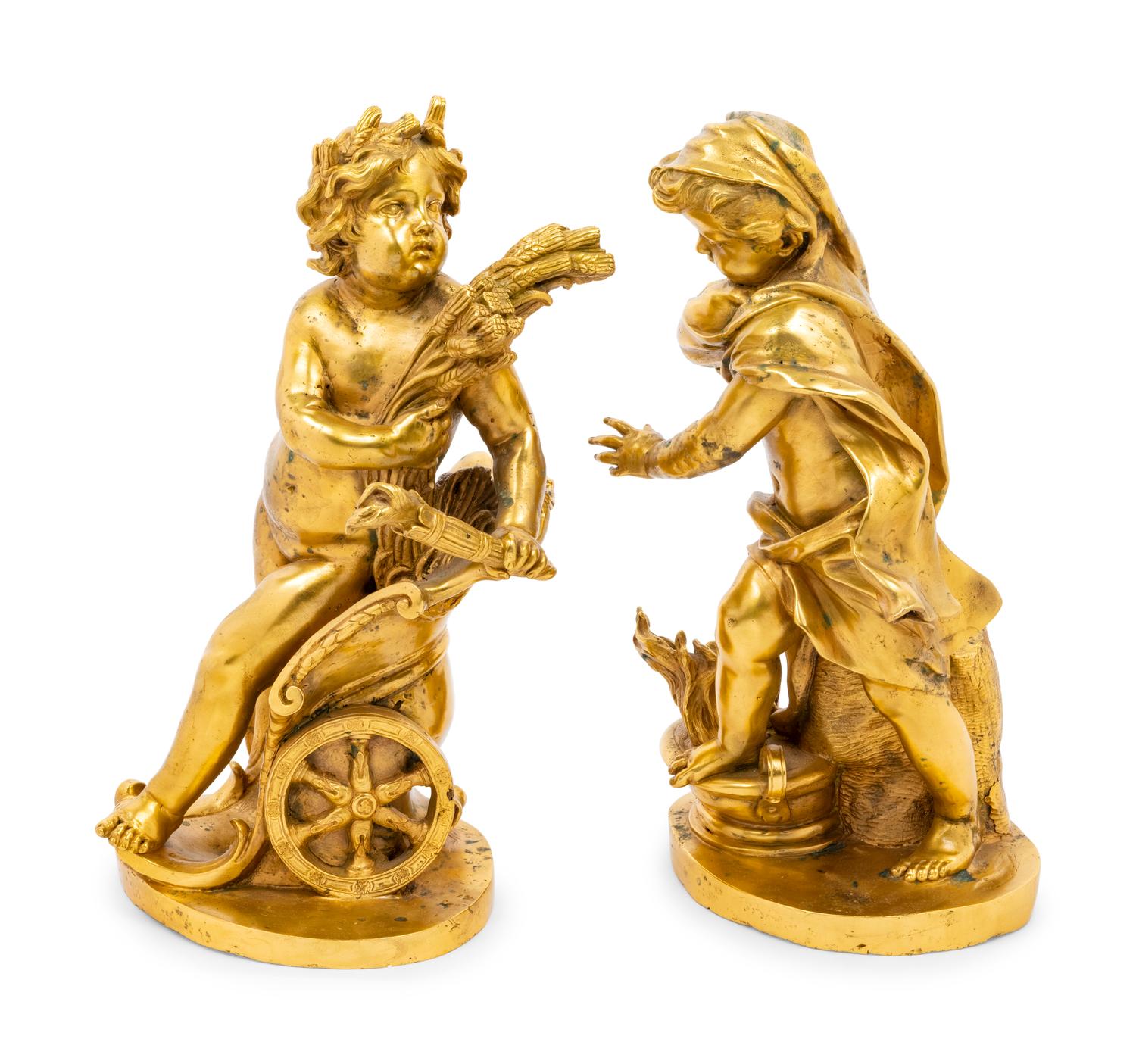 A Pair of Continental Gilt Bronze Putto Ornaments