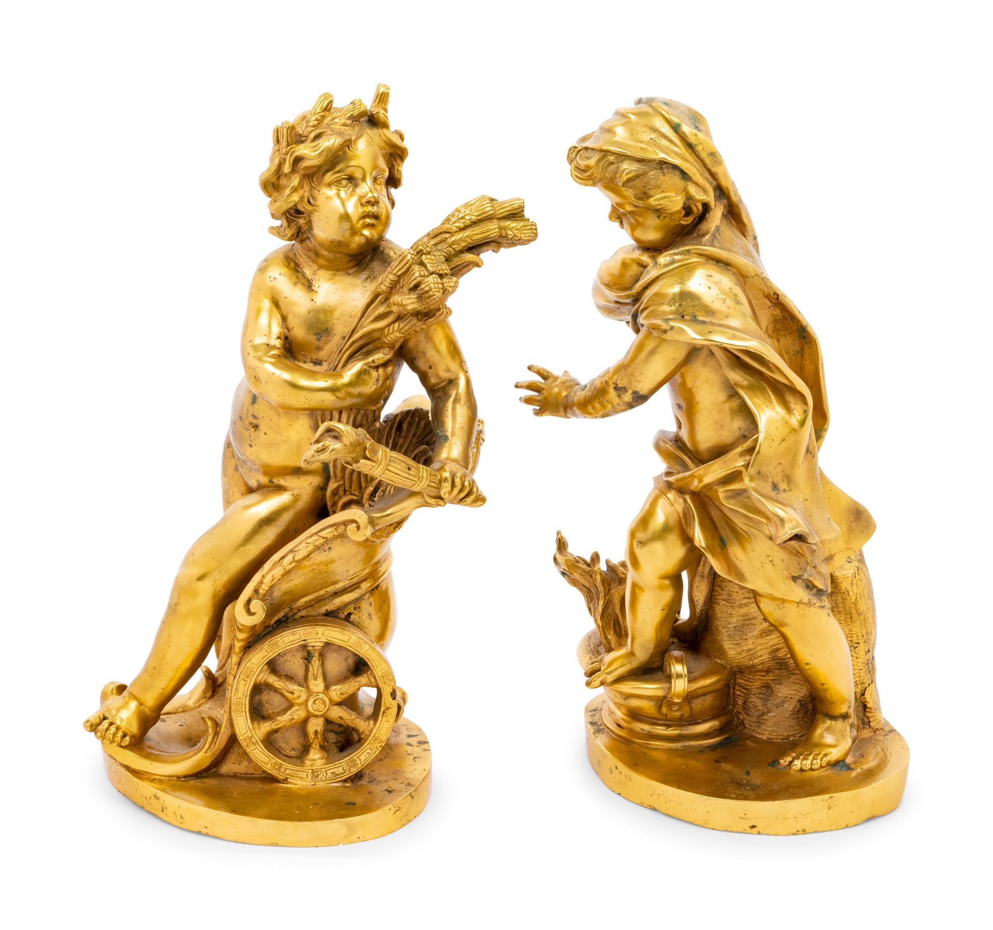 A Pair of Continental Gilt Bronze Putto Ornaments
