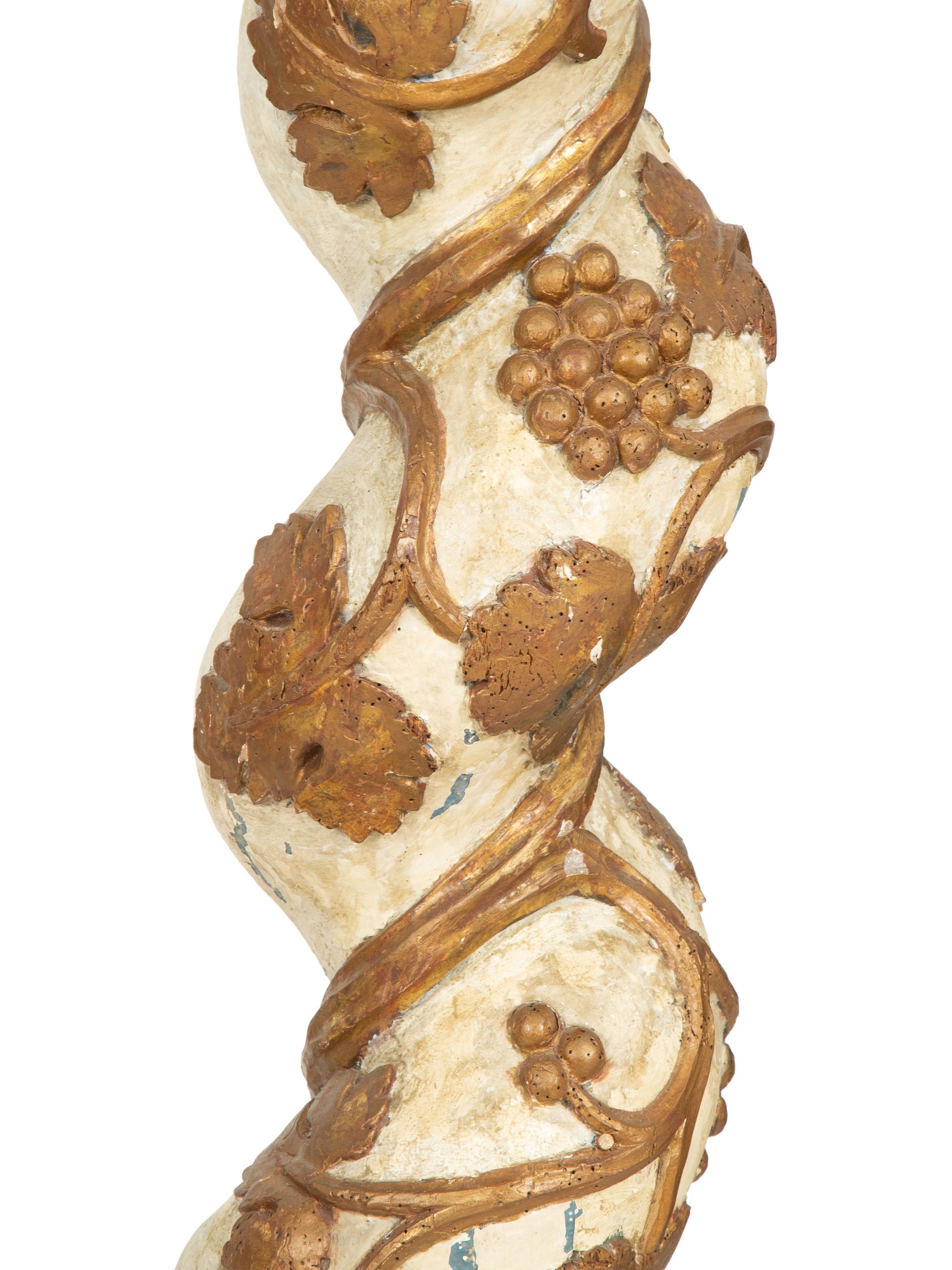 A Pair of Italian Carved, Painted and Parcel Gilt Columms