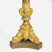 A pair of large French Louis Philippe ormolu candlesticks circa 1830-1840