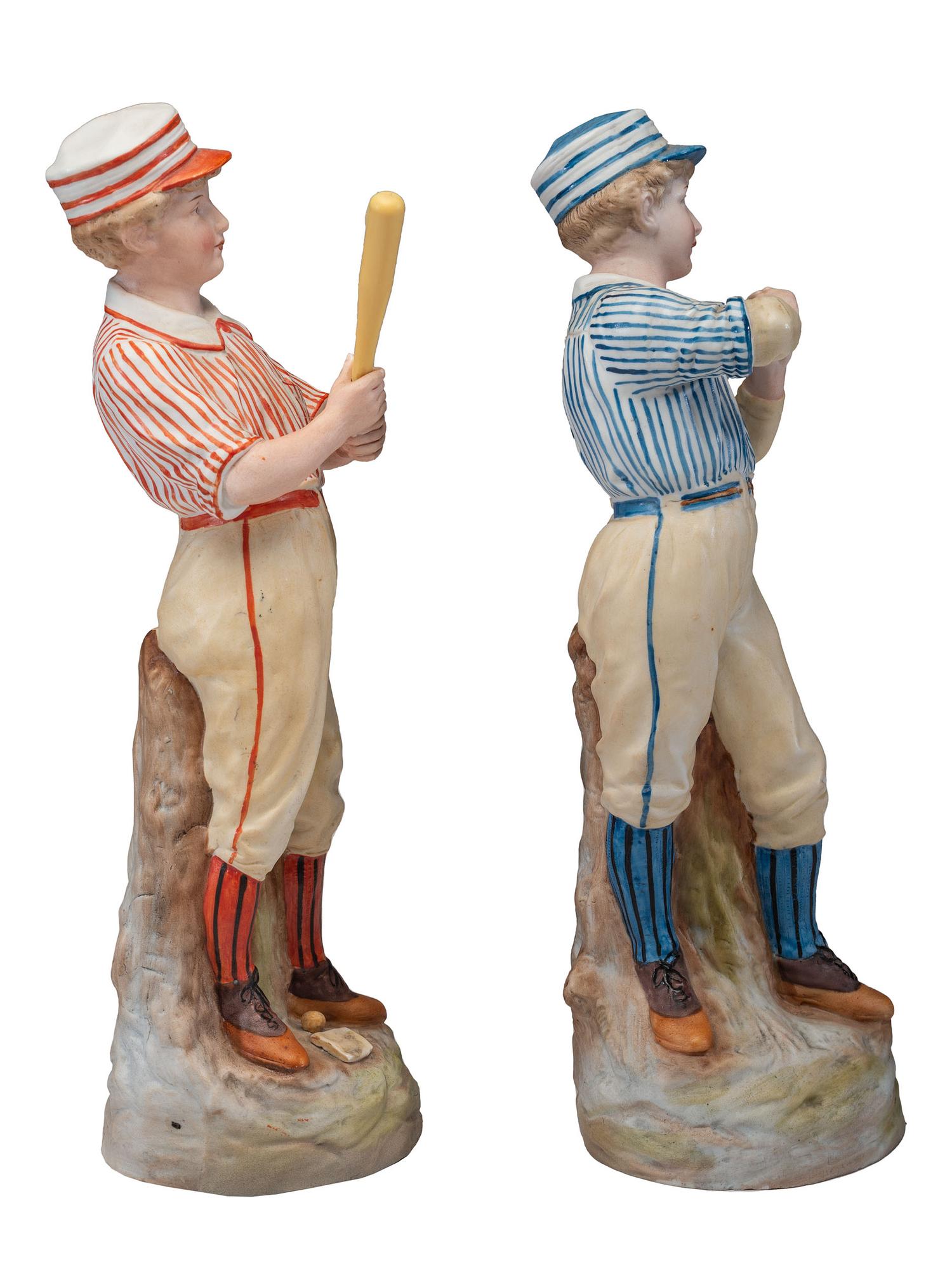 A Pair of German Bisque Porcelain Baseball Figures