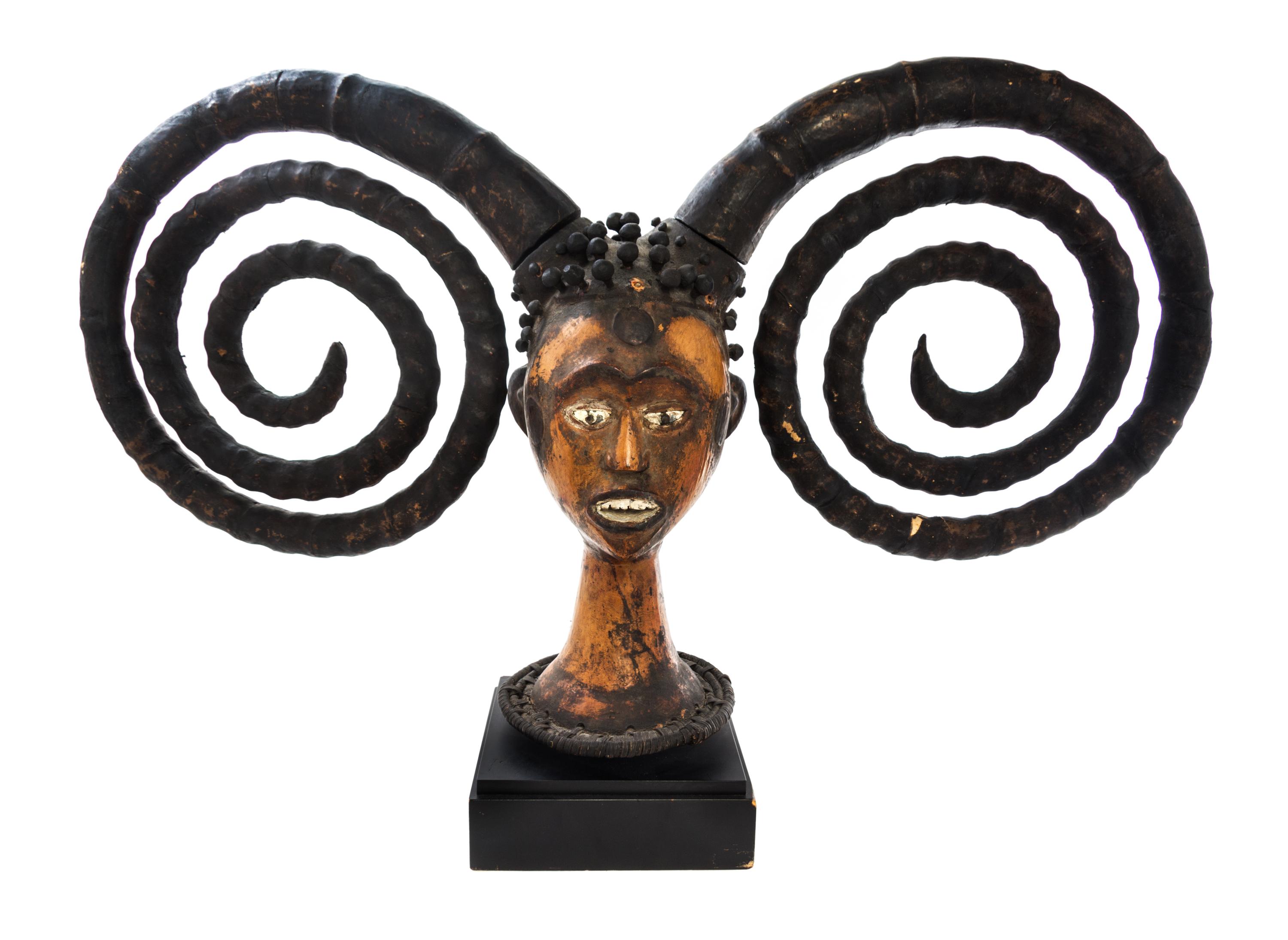 An Ekoi (Nigerian) Carved and Polychrome Decorated Bust Height 19 inches. — 20TH CENTURY