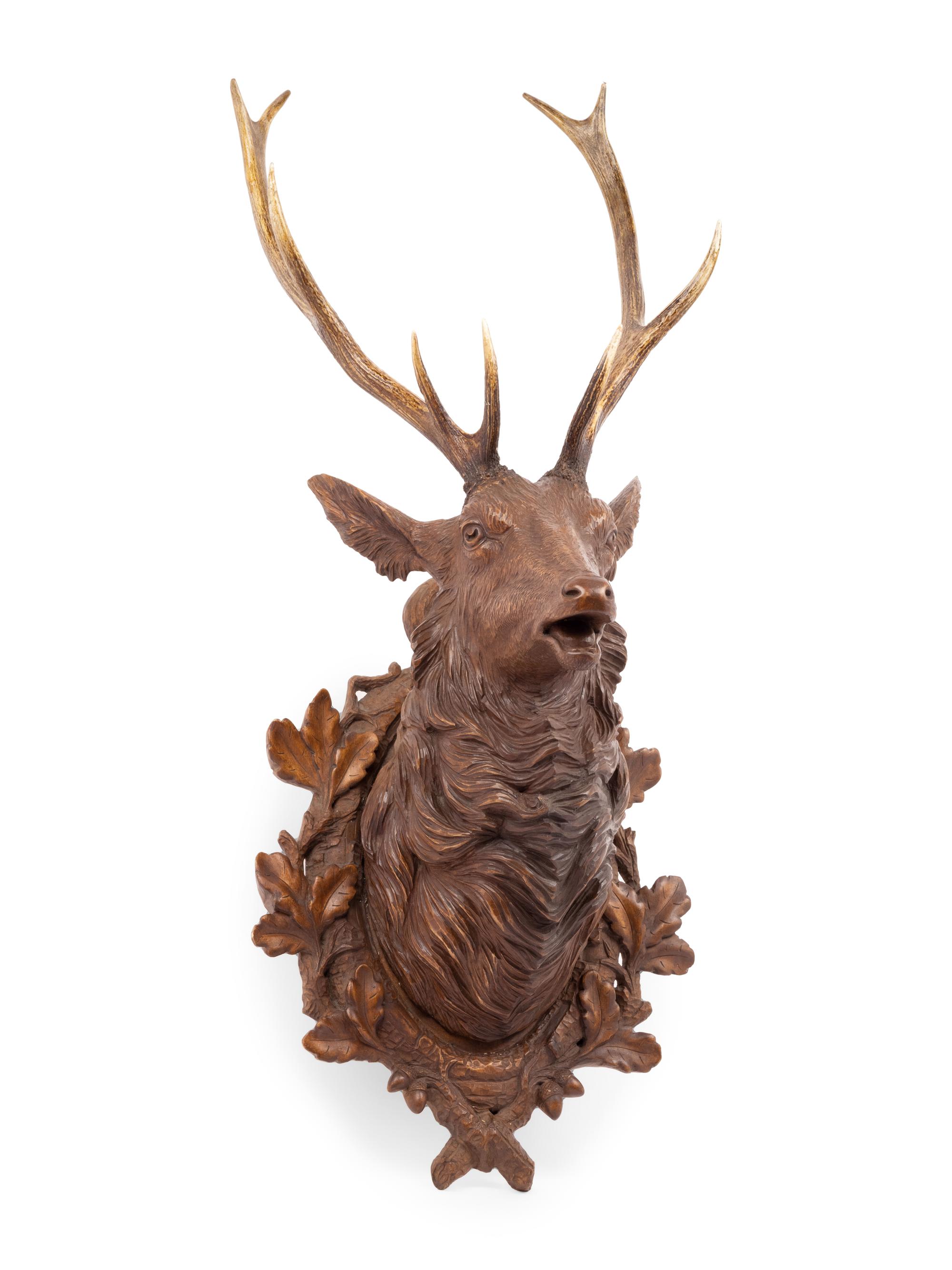A Black Forest Carved Stag Head