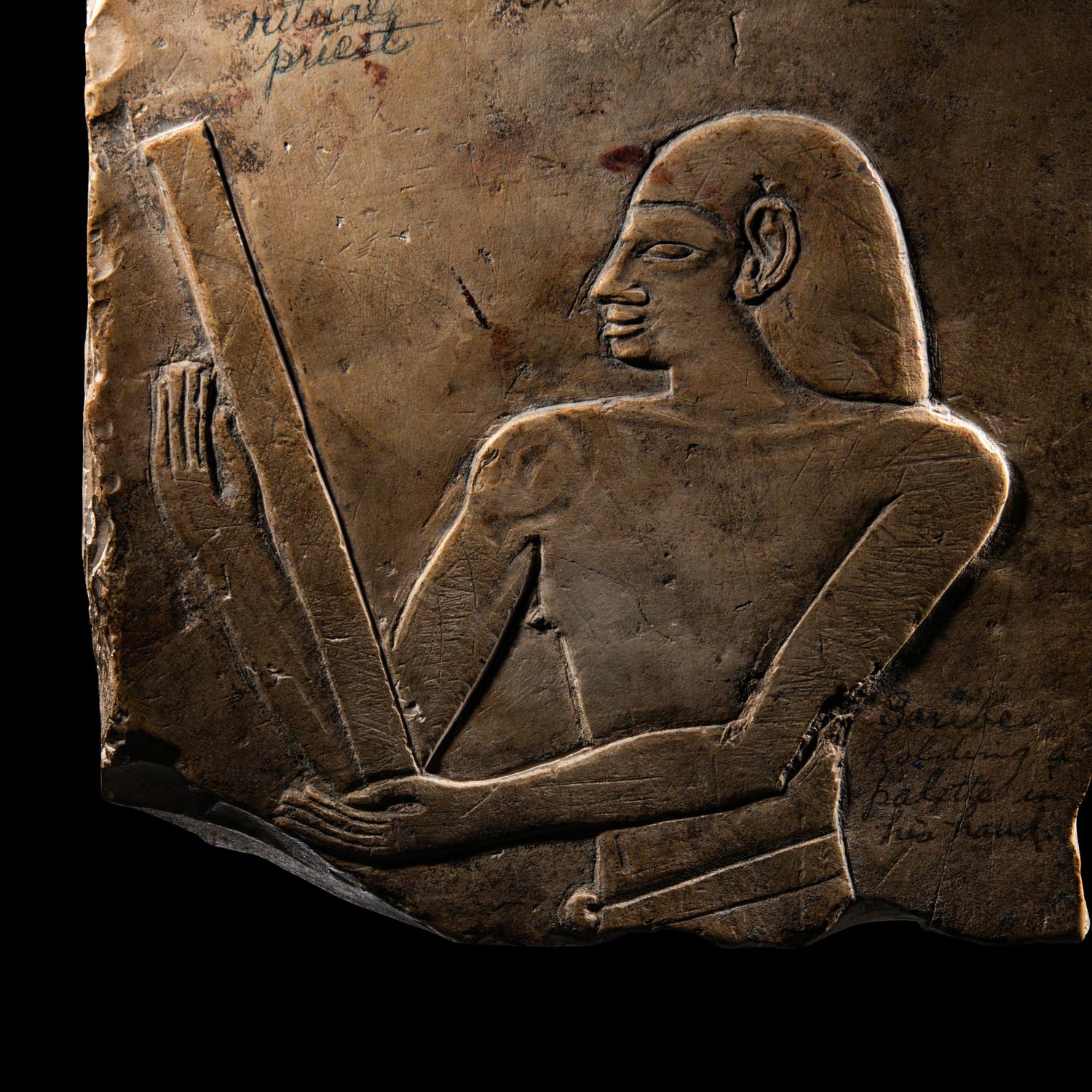 An Egyptian Limestone Relief Fragment with a Priest