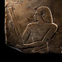 An Egyptian Limestone Relief Fragment with a Priest