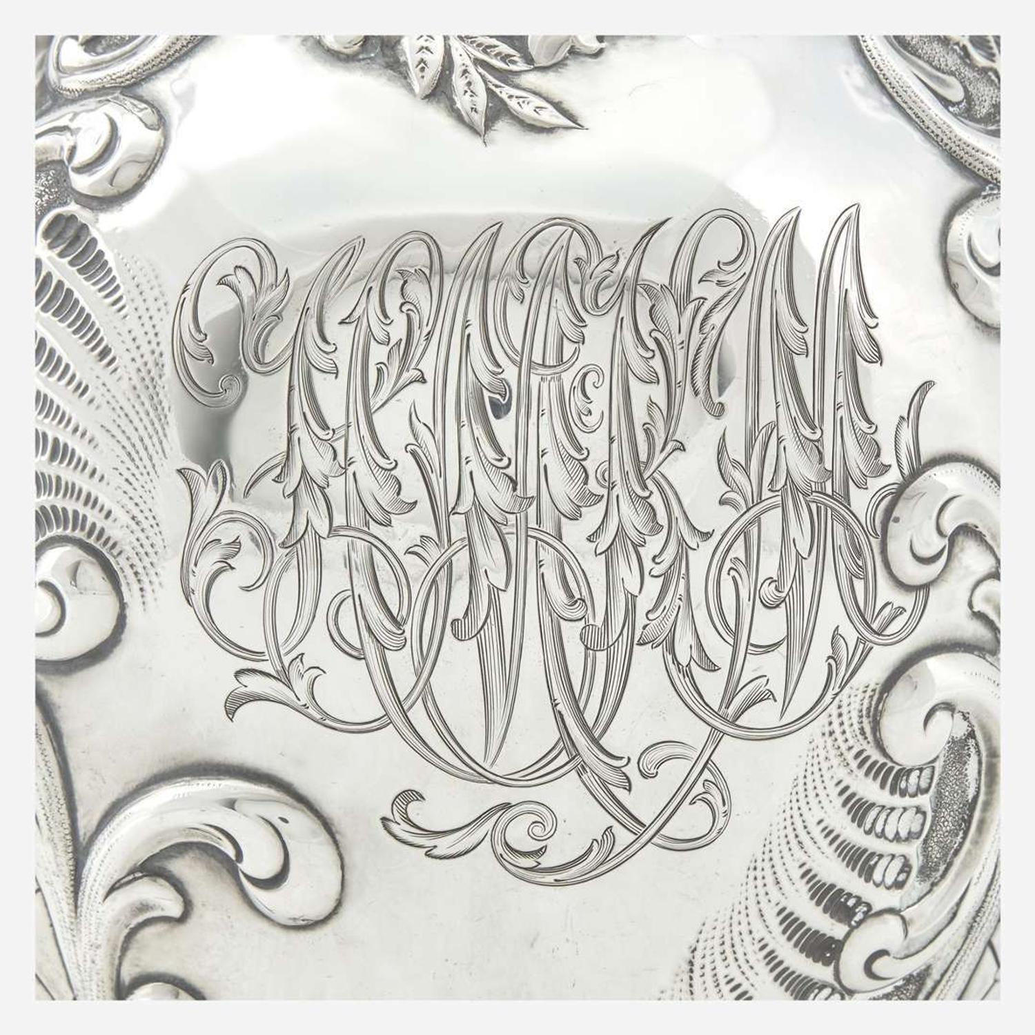 A sterling silver repoussé water pitcher Retailed by Bailey Banks & Biddle, Philadelphia, PA, late 19th century