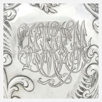 A sterling silver repoussé water pitcher Retailed by Bailey Banks & Biddle, Philadelphia, PA, late 19th century