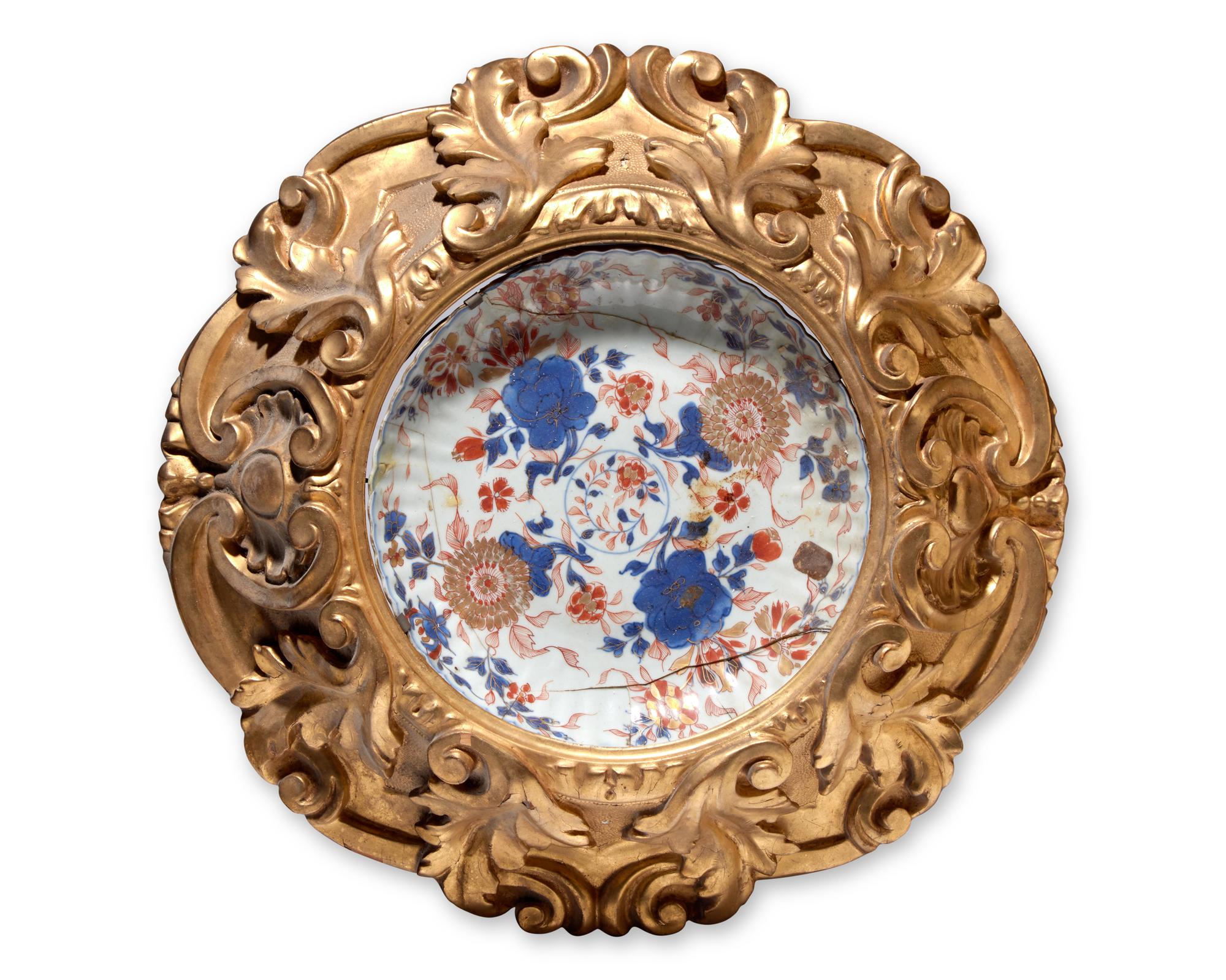 A Chinese Imari porcelain dish mounted in giltwood frame, circa 1700 and later