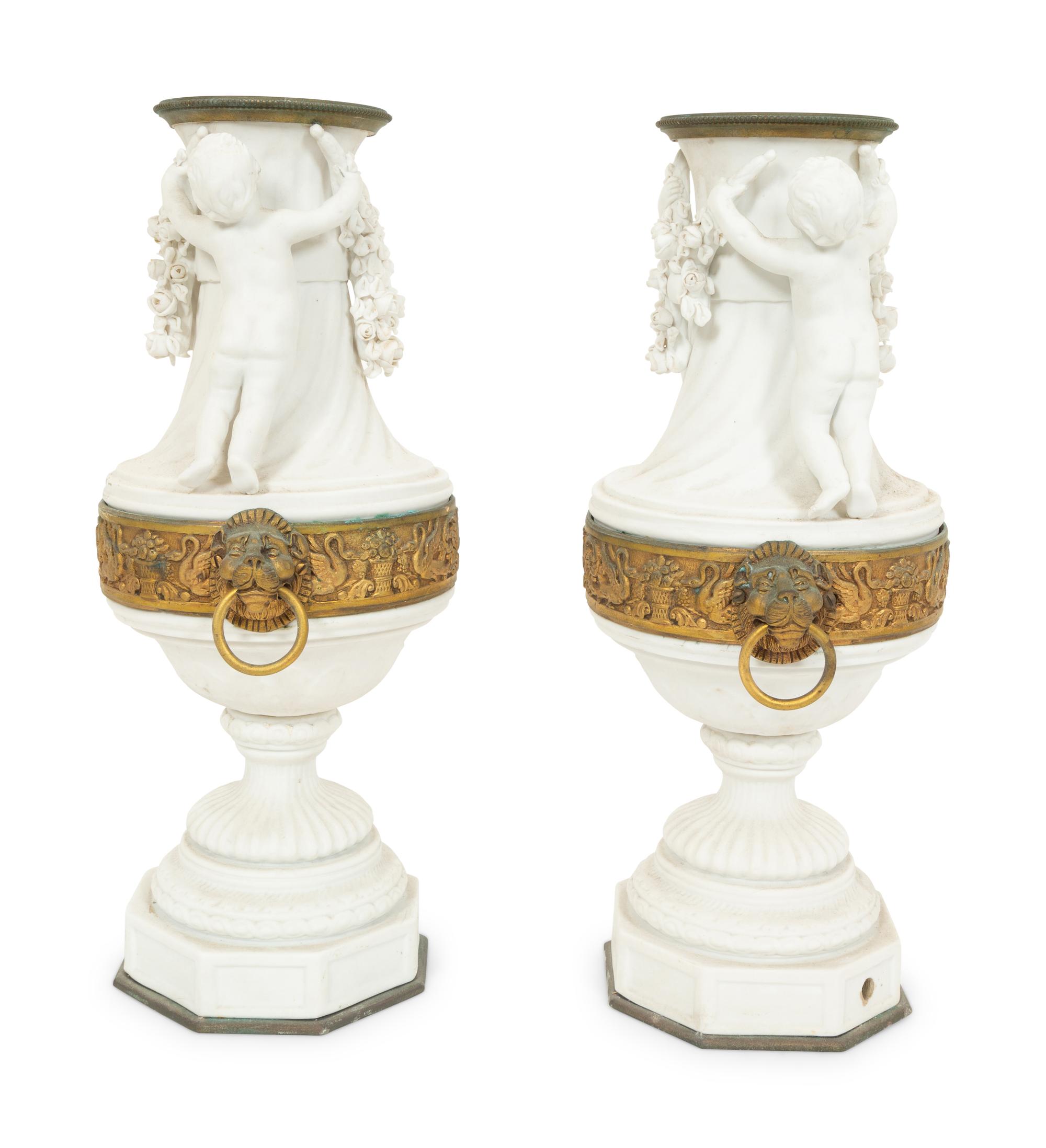 A Pair of Gilt Metal Mounted Bisque Porcelain Urns
