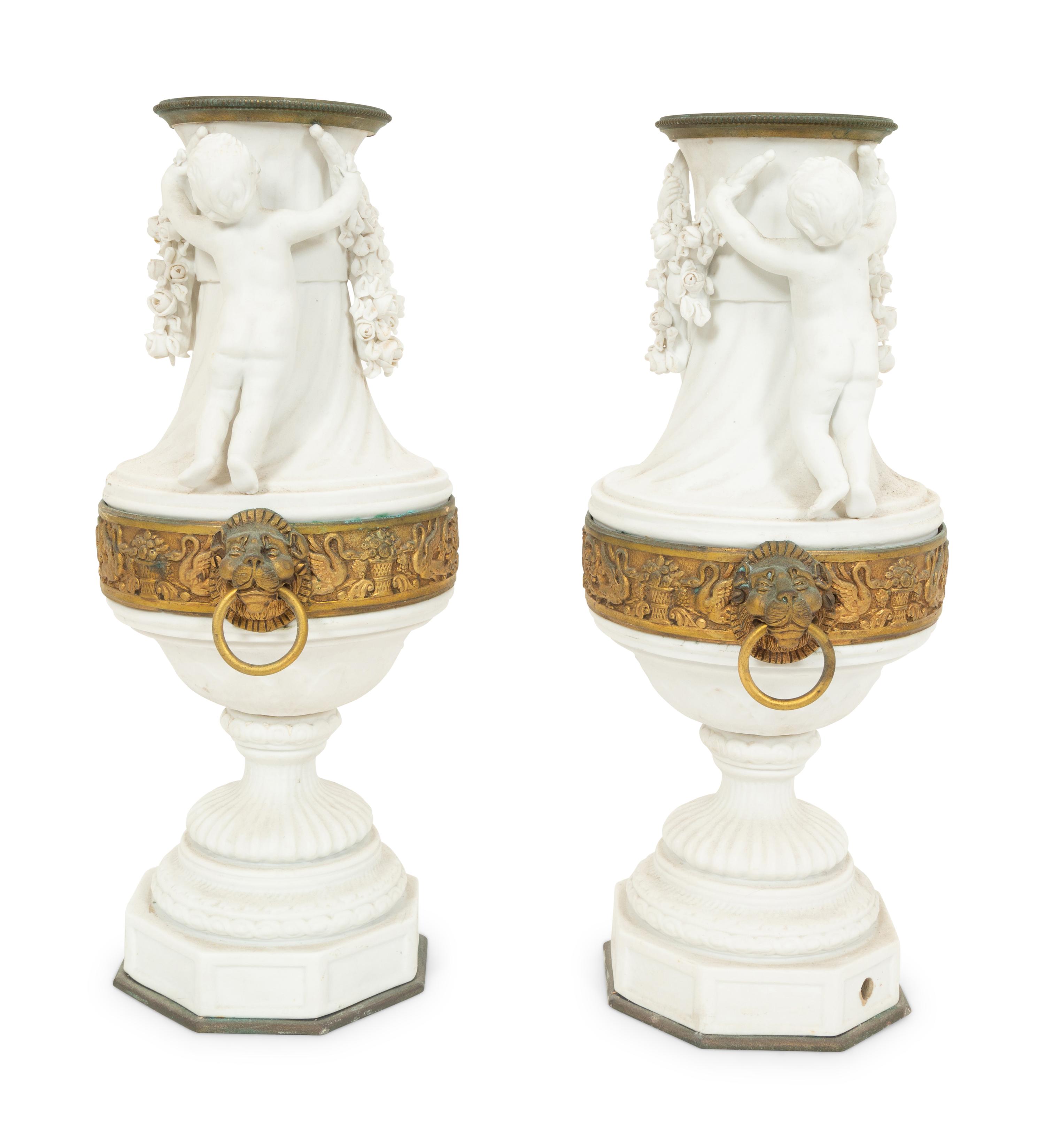 A Pair of Gilt Metal Mounted Bisque Porcelain Urns