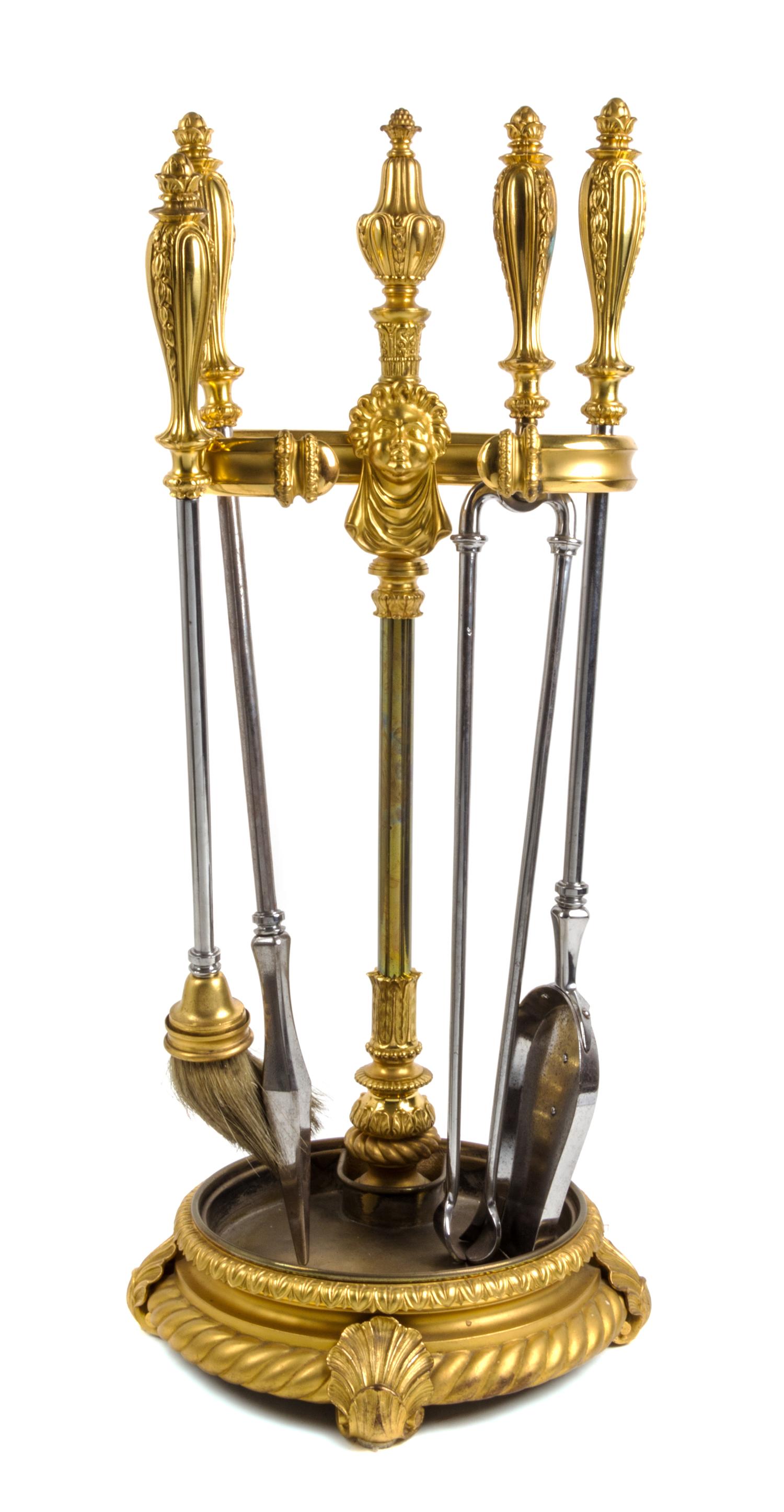 A Set of Gilt Bronze Fireplace Tools on Stand Height of stand 34 1/4 inches. — 19TH/20TH CENTURY