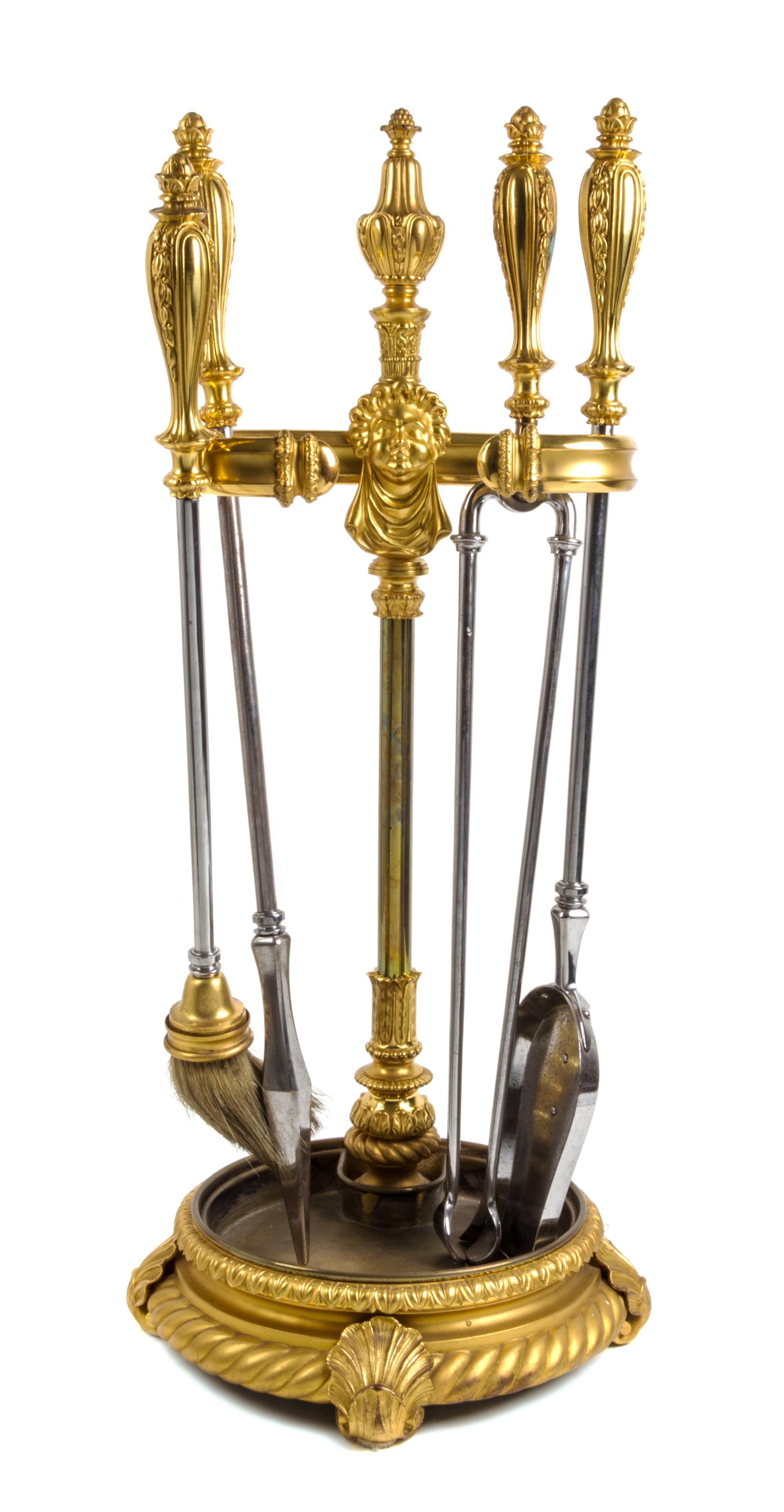 A Set of Gilt Bronze Fireplace Tools on Stand Height of stand 34 1/4 inches. — 19TH/20TH CENTURY