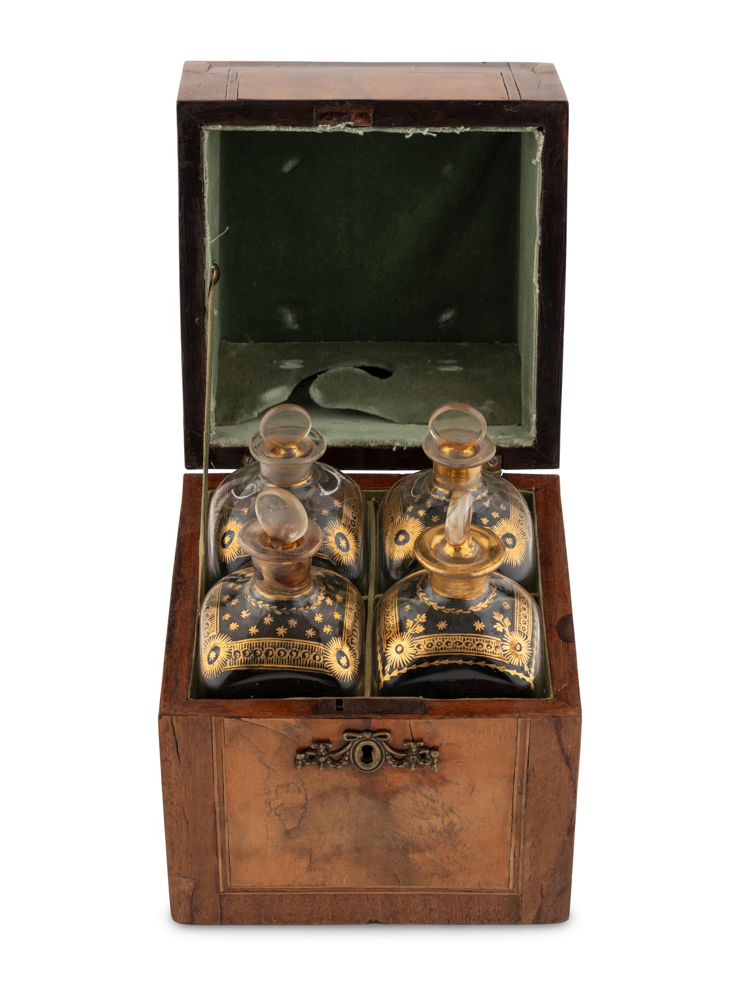 A Walnut and Mahogany Tantalus and Three Silver-Mounted Horn Tumblers