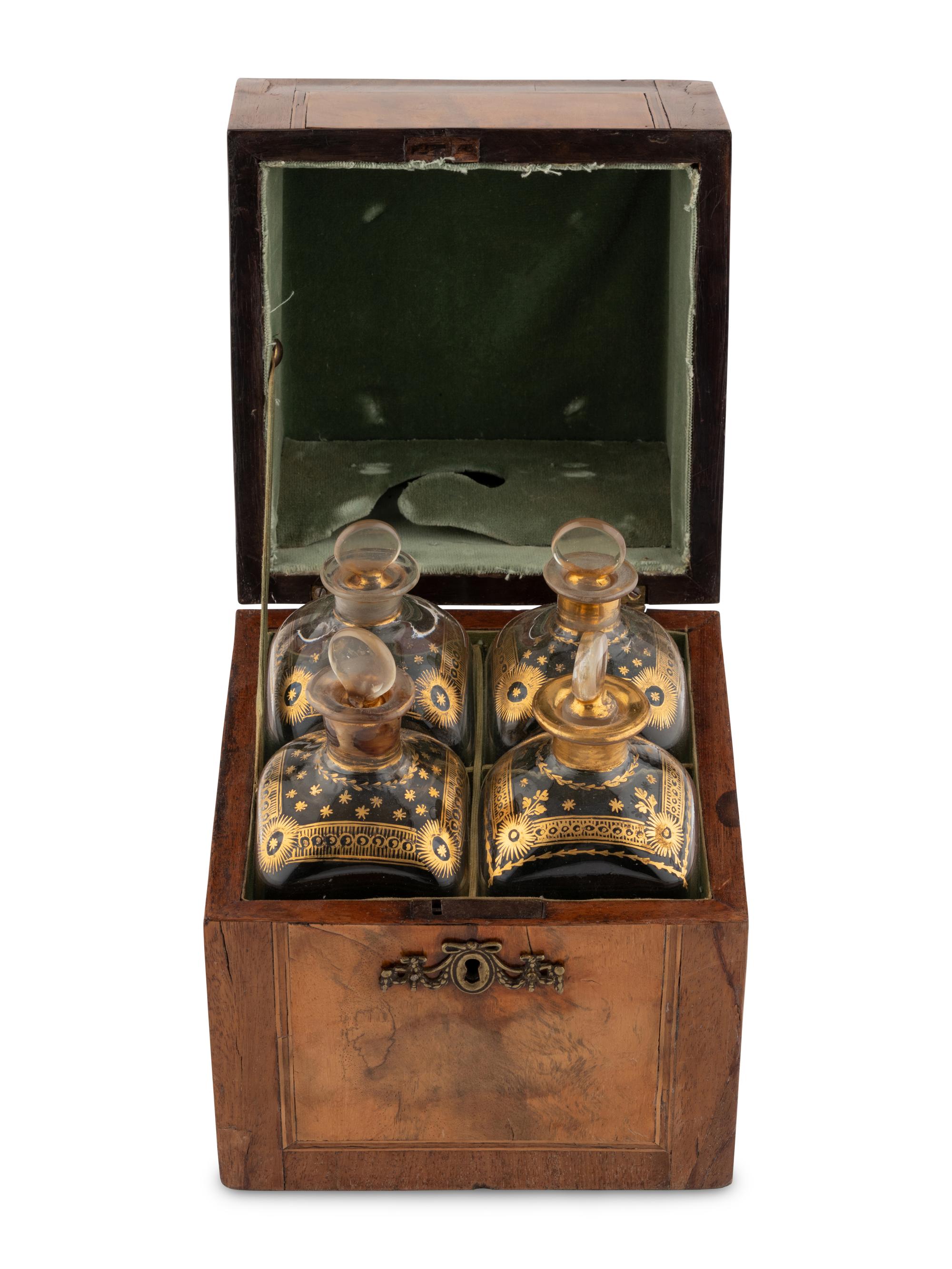 A Walnut and Mahogany Tantalus and Three Silver-Mounted Horn Tumblers