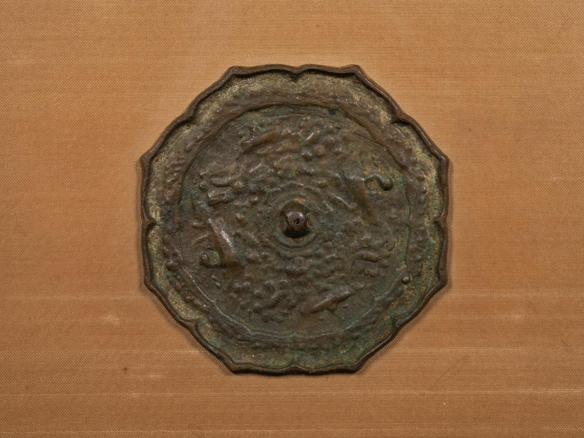 A Bronze Octafoil 'Mythical Beasts' Mirror