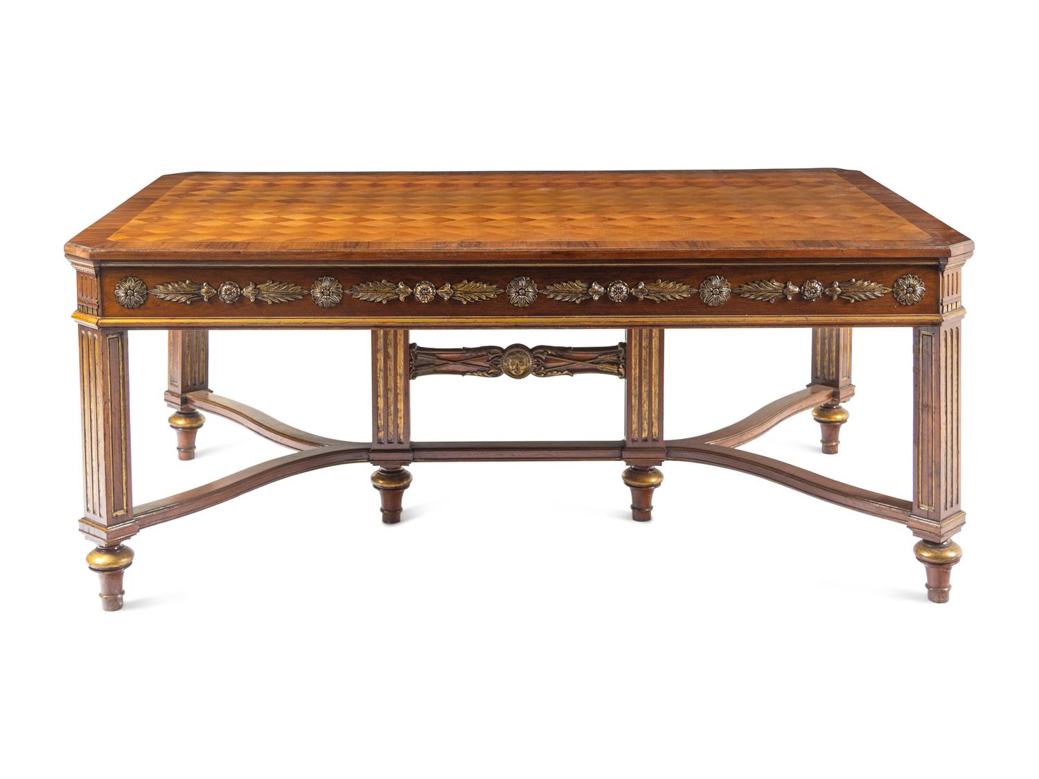 A Louis XVI Style Parcel Gilt Parquetry and Walnut Dining Table