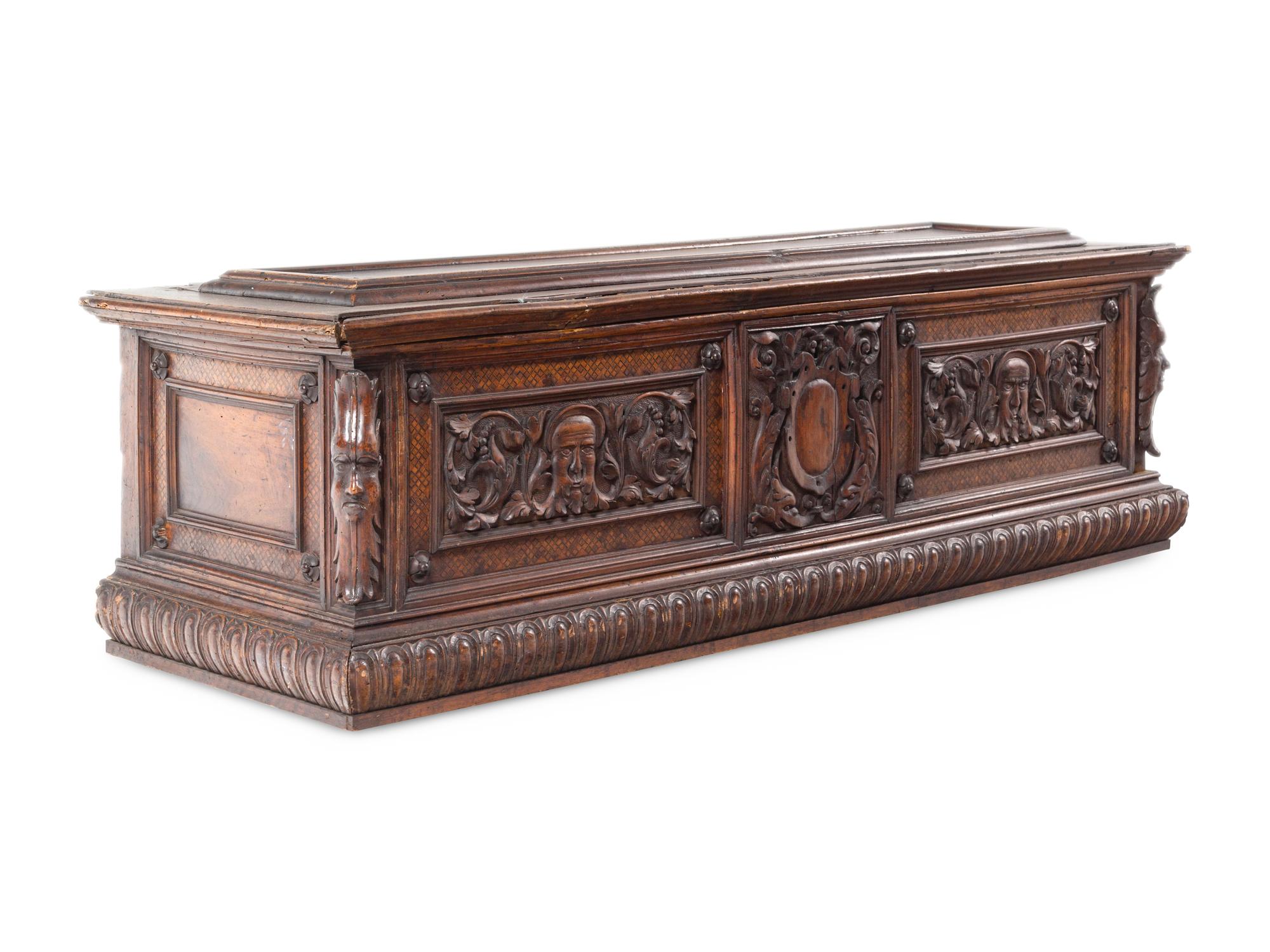 A Continental Carved Walnut Cassone