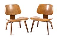 A Pair of LCW Lounge Chairs, Charles and Ray Eames Height 26 1/4 x width 17 1/2 x depth 19 1/2 inches.