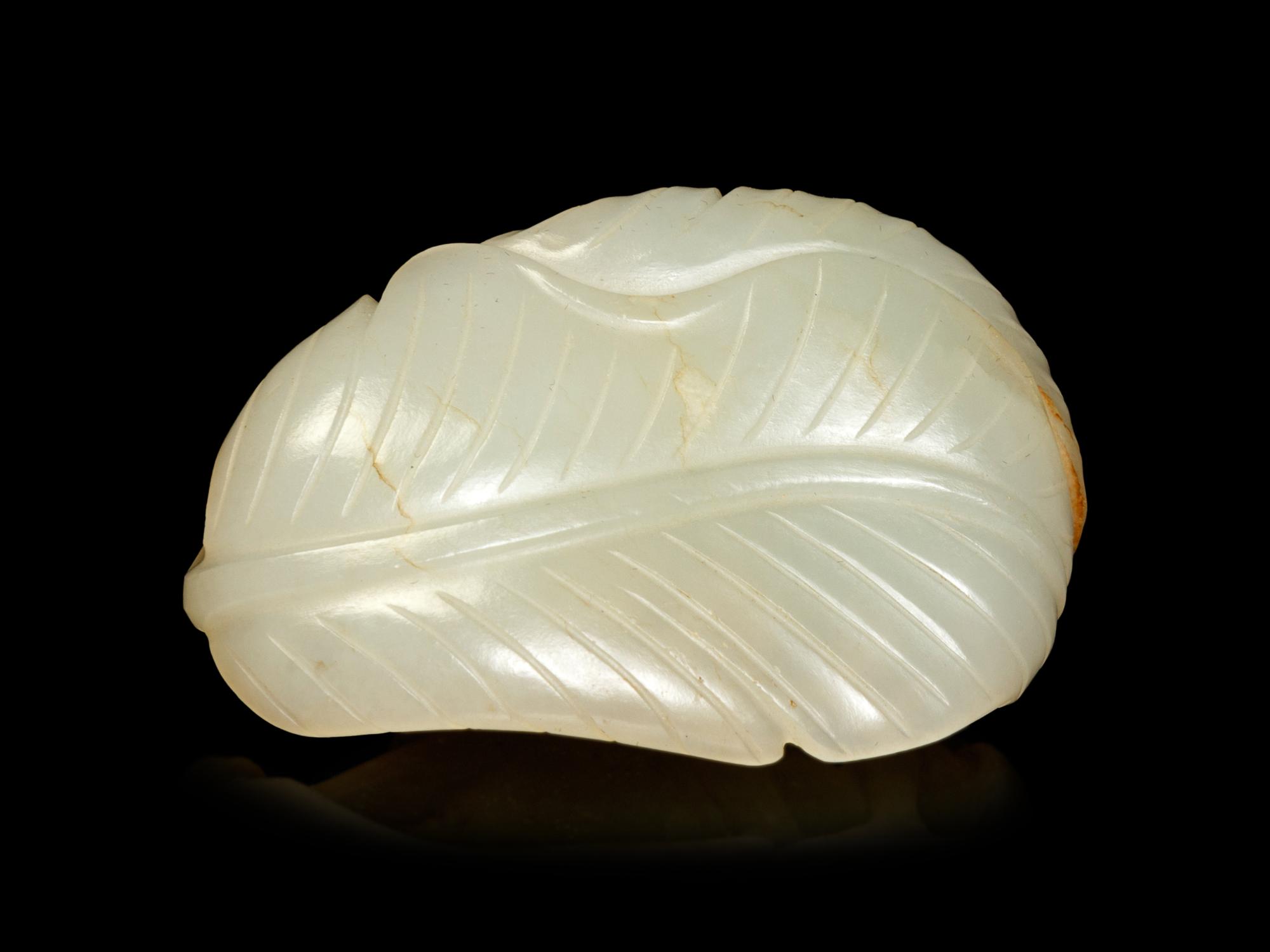A White Jade Carving of An Erotic Scene