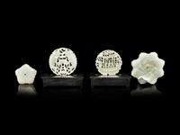 Four Reticulated Celadon Jade Pendants