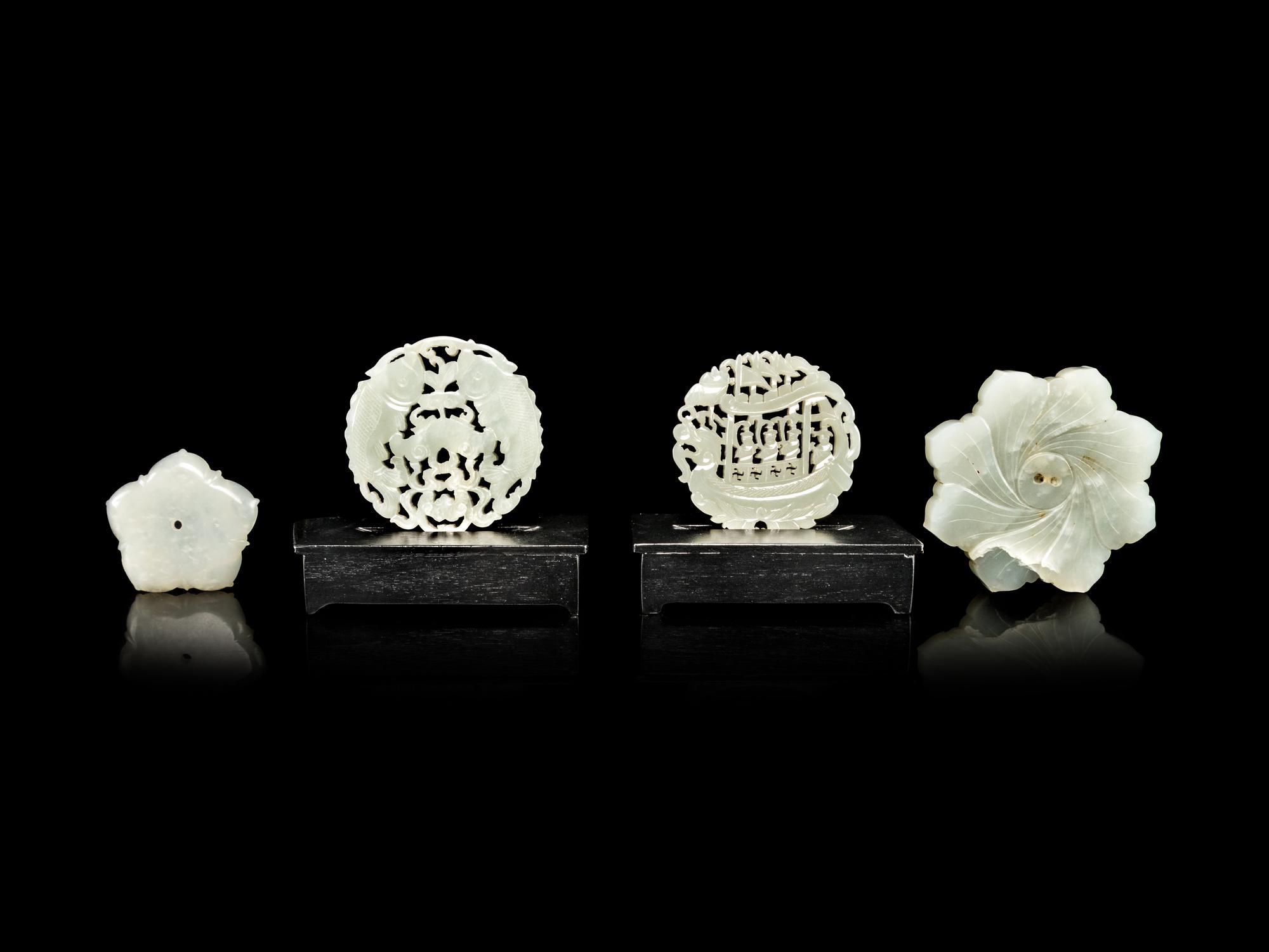Four Reticulated Celadon Jade Pendants