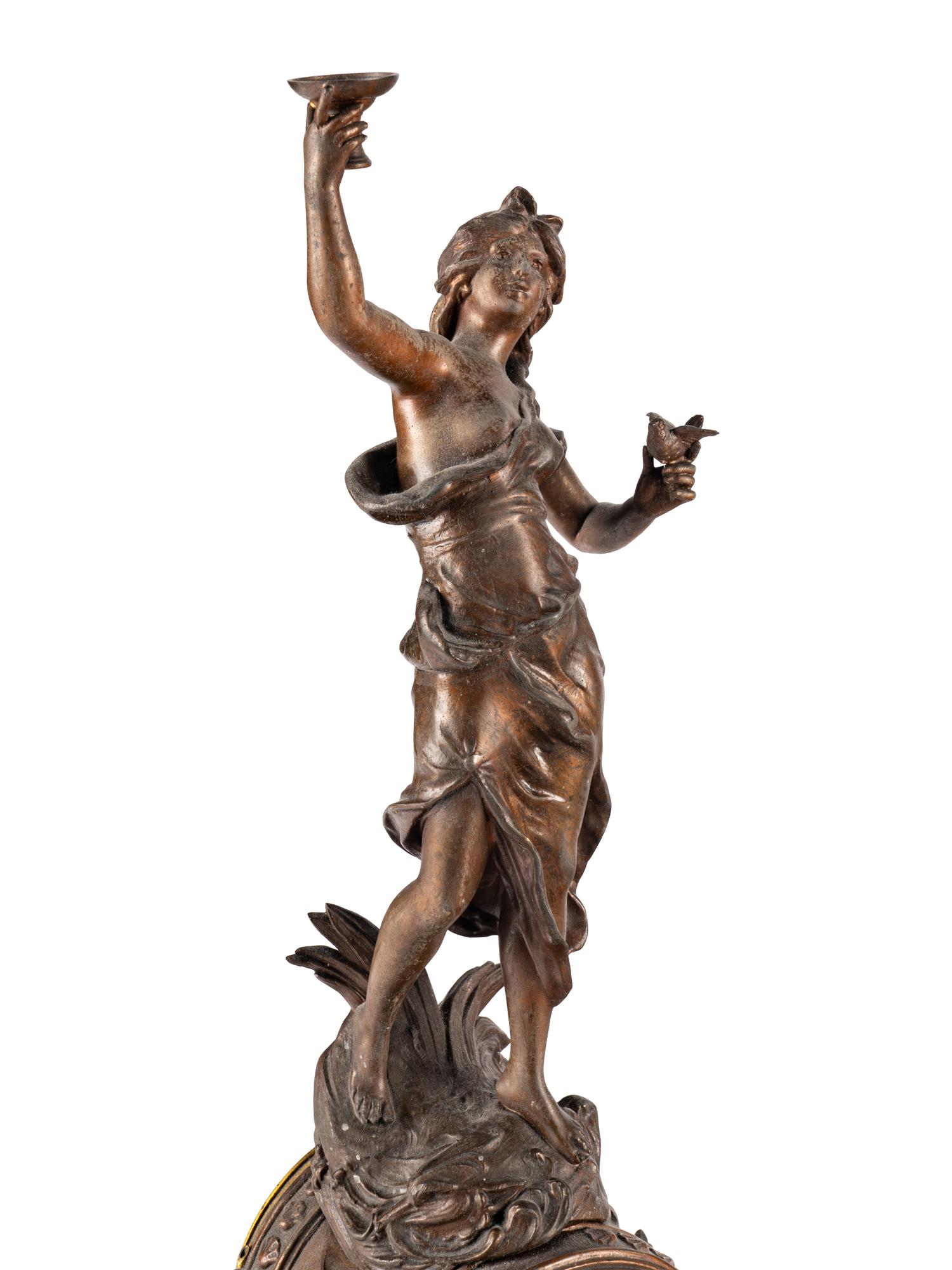 A French Cast Metal and Marble Figural Clock